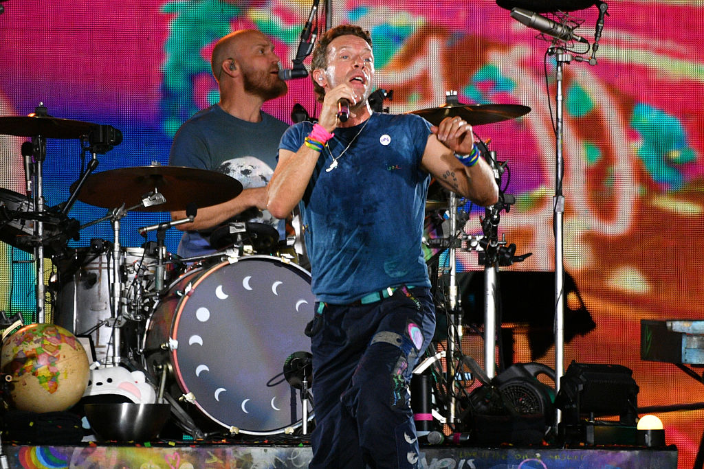 LONDON, ENGLAND - AUGUST 22: (EDITORIAL USE ONLY) Chris Martin of Coldplay performs during the 'Music Of The Spheres World Tour' at Wembley Stadium on August 22, 2025 in London, England. Coldplay will perform ten shows at Wembley Stadium during August & September, bringing to a close the most-attended concert tour in history, watched by over 12 million fans across 43 countries. (Photo by Jim Dyson/Getty Images)