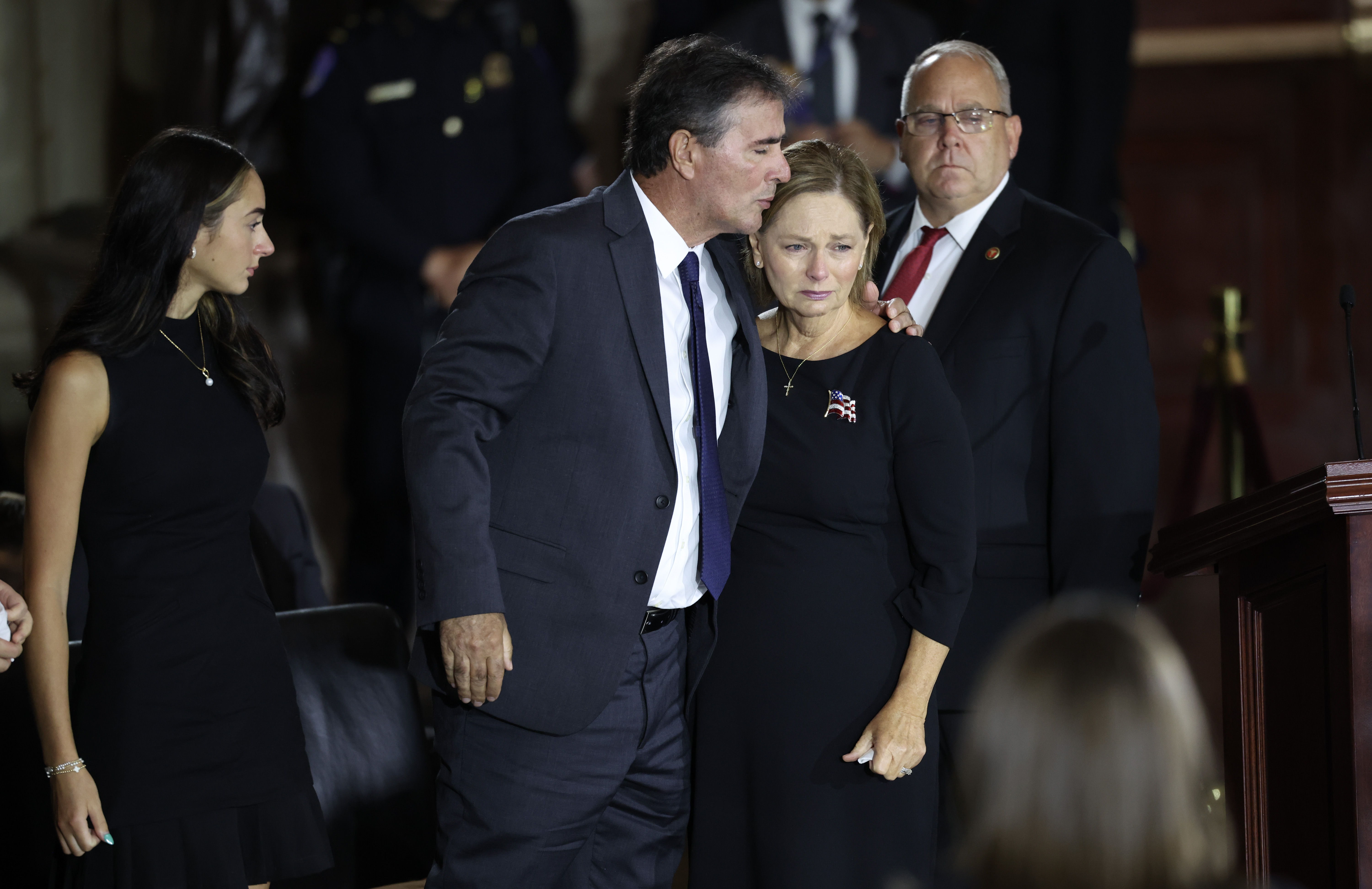 WASHINGTON, DC - JULY 28: U.S. Sen. Darline Graham Nordone (R-SC) (R) is embraced by her husband Larry Nordone as they pay their respects over the casket during memorial tribute for the late U.S. Sen. Lindsey Graham (R-SC) in the Rotunda of the U.S. Capitol on July 28, 2026 in Washington, DC. Graham,&nbsp;who was elected to the Senate in 2002, died suddenly on July 11th from an aortic dissection. He was 71 years old. (Photo by Win McNamee/Getty Images)