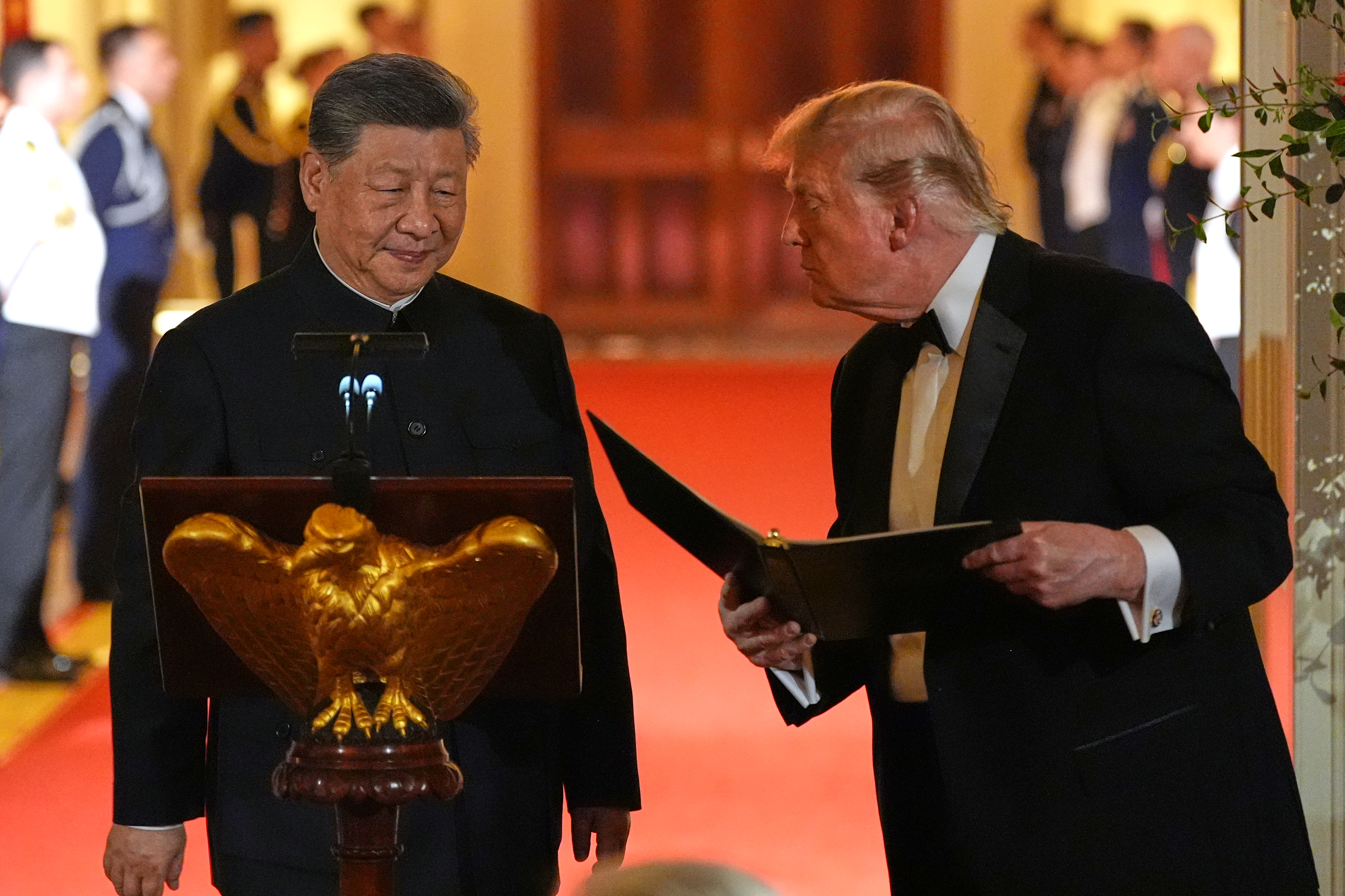 President Donald Trump talks with China's President Xi Jinping during a State Dinner in the East Room of the White House, Thursday, Sept. 24, 2026, in Washington. (AP Photo/Alex Brandon)