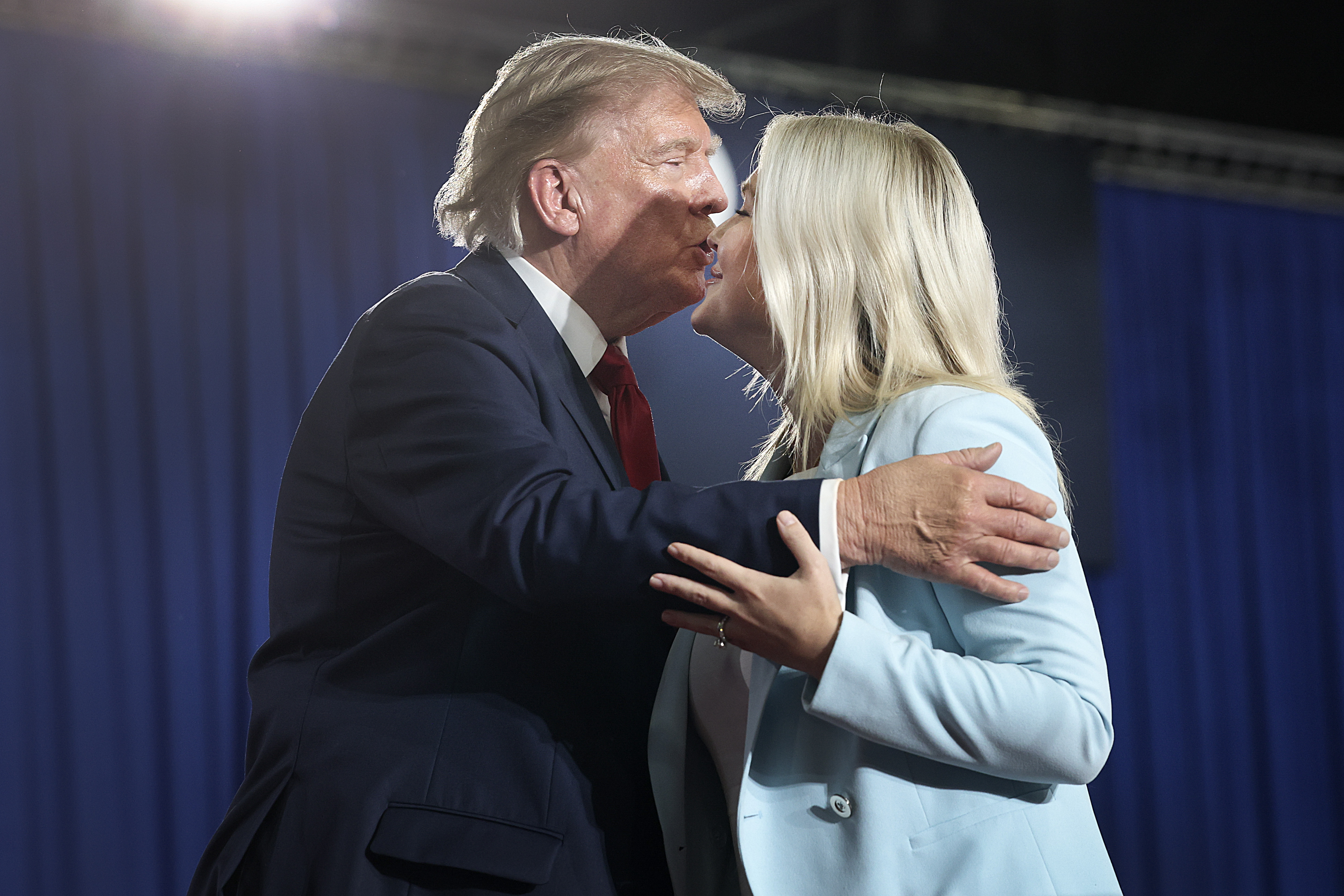 MYRTLE BEACH, SOUTH CAROLINA - AUGUST 21: U.S. President Donald Trump greets Press Secretary Karoline Leavitt during a campaign rally with U.S. Sen. Darline Graham (R-SC) on August 21, 2026 in Myrtle Beach, South Carolina. President Trump traveled to South Carolina to join Republican Senate candidate Darline Graham for a campaign rally ahead of Tuesday's runoff election against Ralph Norman. (Photo by Win McNamee/Getty Images)