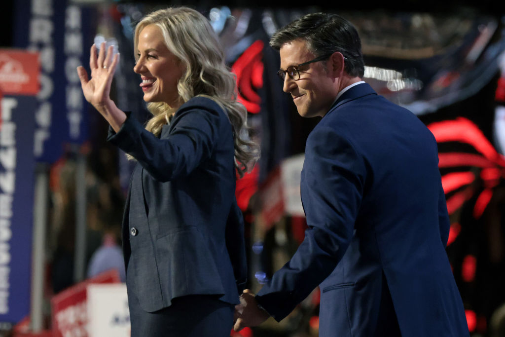 MILWAUKEE, WISCONSIN - JULY 16: Speaker of the House Mike Johnson (R-LA) and his wife, Kelly Johnson, appear on stage on the second day of the Republican National Convention at the Fiserv Forum on July 16, 2024 in Milwaukee, Wisconsin. Delegates, politicians, and the Republican faithful are in Milwaukee for the annual convention, concluding with former President Donald Trump accepting his party's presidential nomination. The RNC takes place from July 15-18. (Photo by Scott Olson/Getty Images)