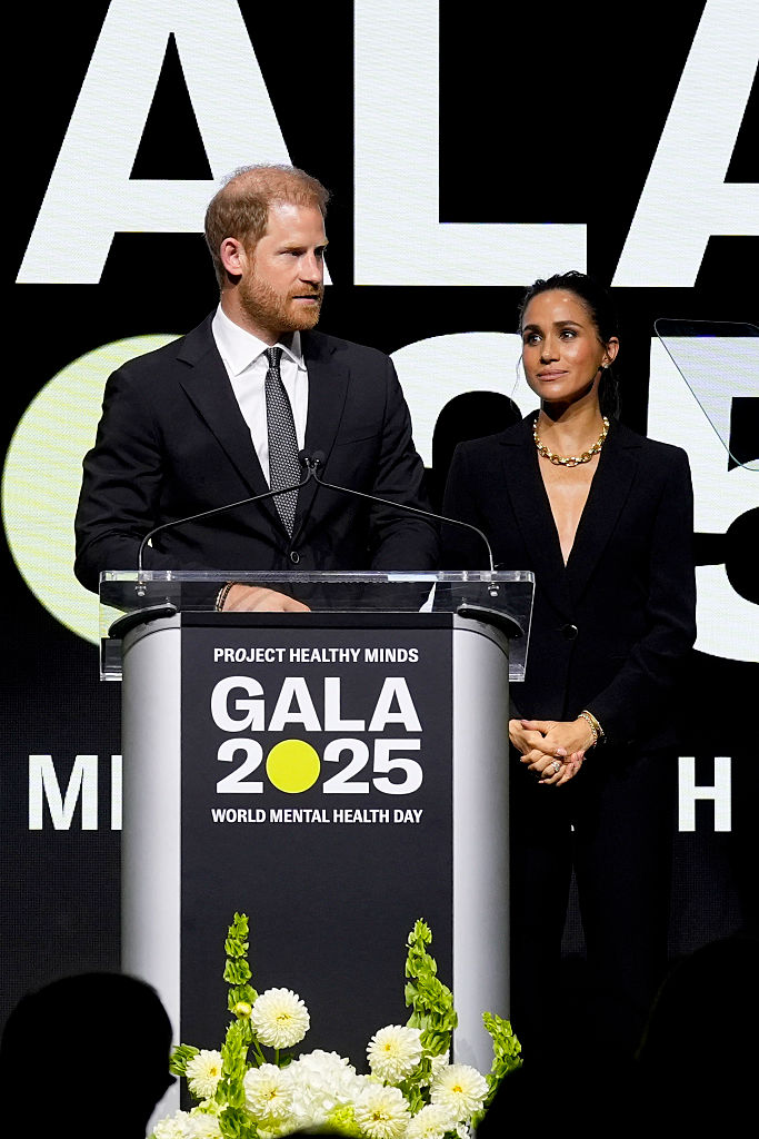 NEW YORK, NEW YORK - OCTOBER 09: (L-R) Prince Harry, Duke of Sussex, and Meghan, Duchess of Sussex, speak onstage the Project Healthy Minds World Mental Health Day Gala at Spring Studios on October 09, 2025 in New York City. (Photo by Ilya S. Savenok/Getty Images for Project Healthy Minds)