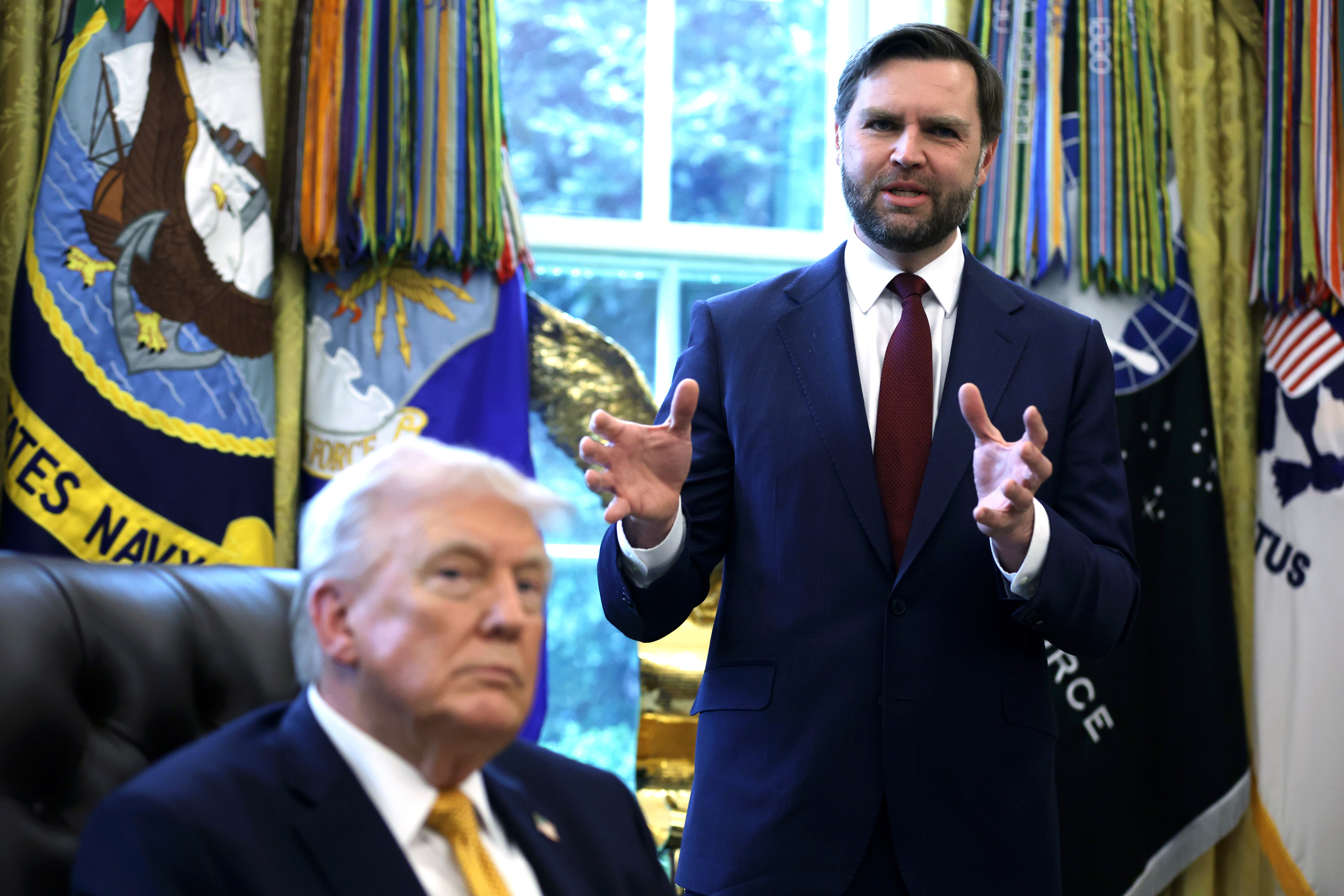 WASHINGTON, DC - MARCH 16: U.S. Vice President JD Vance (R) speaks to the media after President Donald Trump (L) signing a document during a White House signing ceremony in the Oval Office of the White House on March 16, 2026 in Washington, DC. Trump signed an executive order to create a task force on fraud which will be lead by Vice President J.D. Vance. (Photo by Alex Wong/Getty Images)