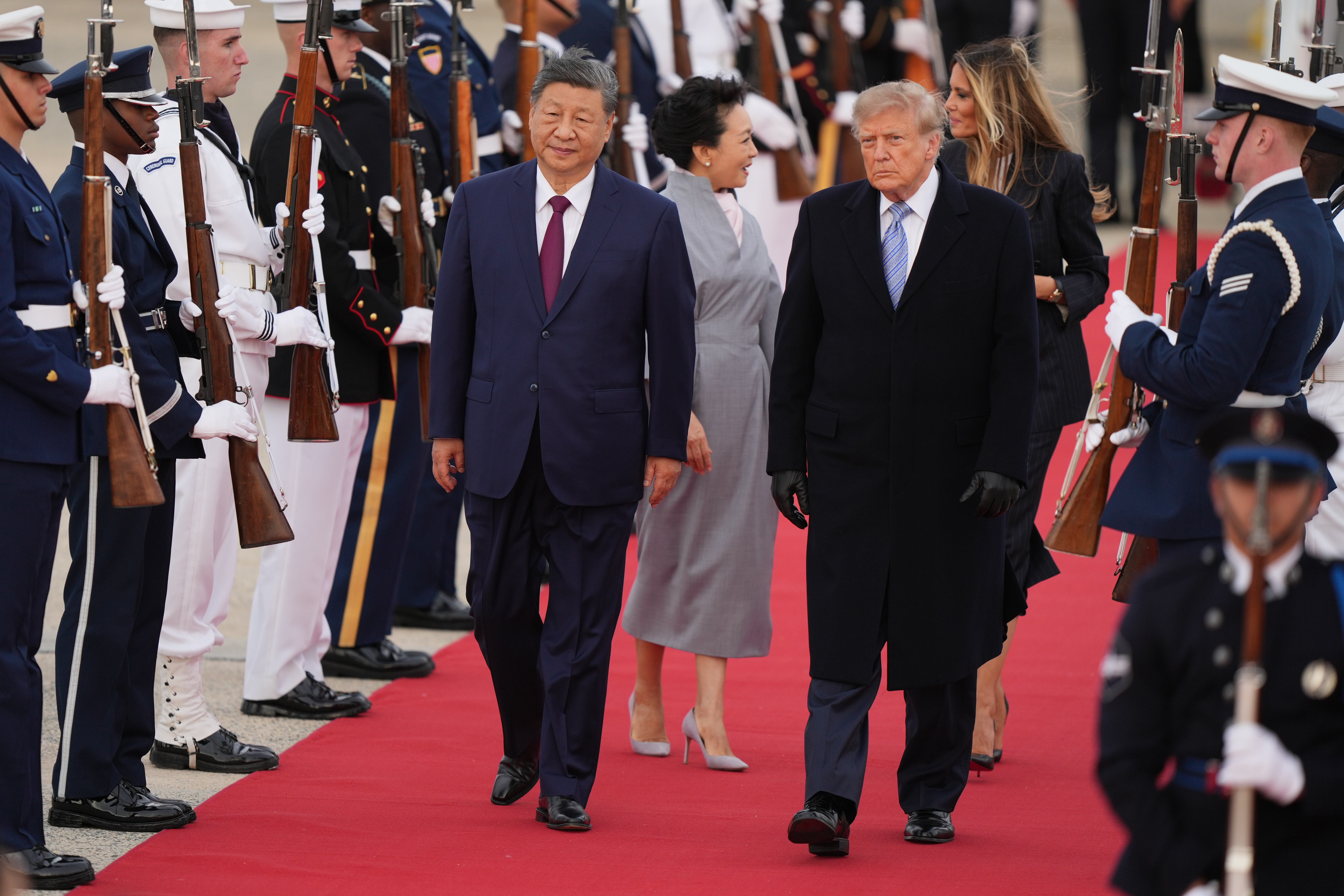 President Donald Trump and first lady Melania Trump greet Chinese President Xi Jinping and his wife Peng Liyuan as they arrive at Joint Base Andrews, Md., Wednesday, Sept. 23, 2026. (AP Photo/Mark Schiefelbein)