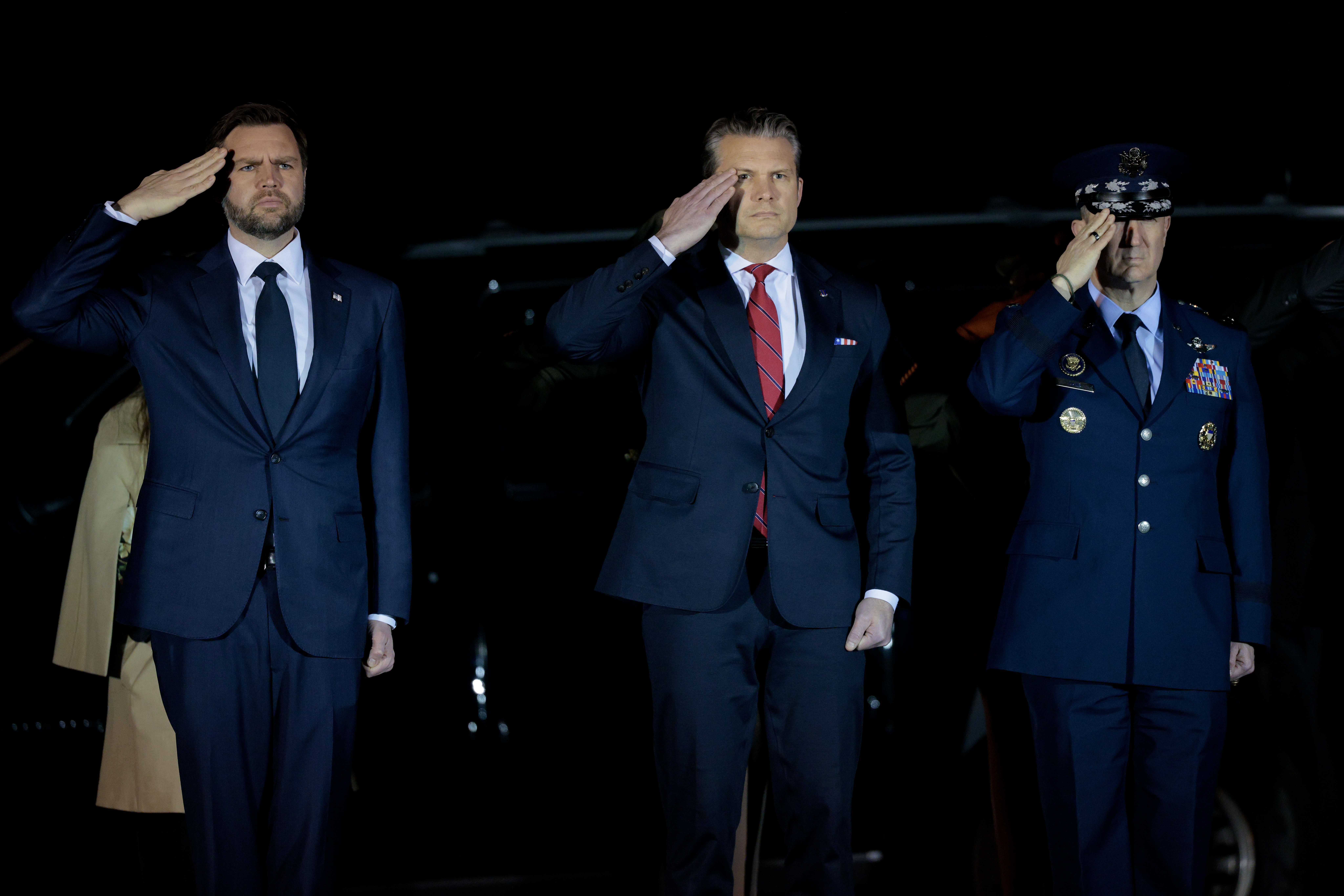 DOVER, DELAWARE - MARCH 09: U.S. Vice President JD Vance (L) and Secretary of War Pete Hegseth salute as a U.S. Army carry team moves a flag-draped transfer case containing the remains of Army Sgt. Benjamin N. Pennington at Dover Air Force Base on March 9, 2026 in Dover, Delaware. Pennington died of injuries sustained from an Iranian attack on Prince Sultan Air Base in Saudi Arabia on March 1. (Photo by Chip Somodevilla/Getty Images)