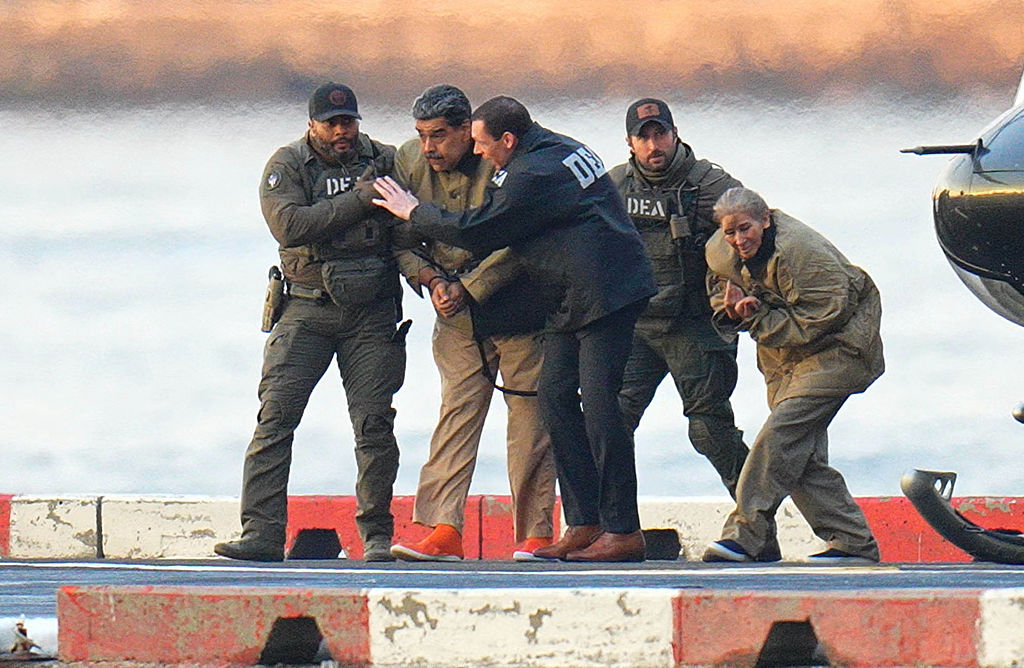 NEW YORK, NY - JANUARY 5: Nicolas Maduro and his wife, Cilia Flores, are seen in handcuffs after landing at a Manhattan helipad, escorted by heavily armed Federal agents as they make their way into an armored car en route to a Federal courthouse in Manhattan on January 5, 2026 in New York City.  (Photo by XNY/Star Max/GC Images) *** Local Caption ***Nicolas Maduro;Cilia Flores