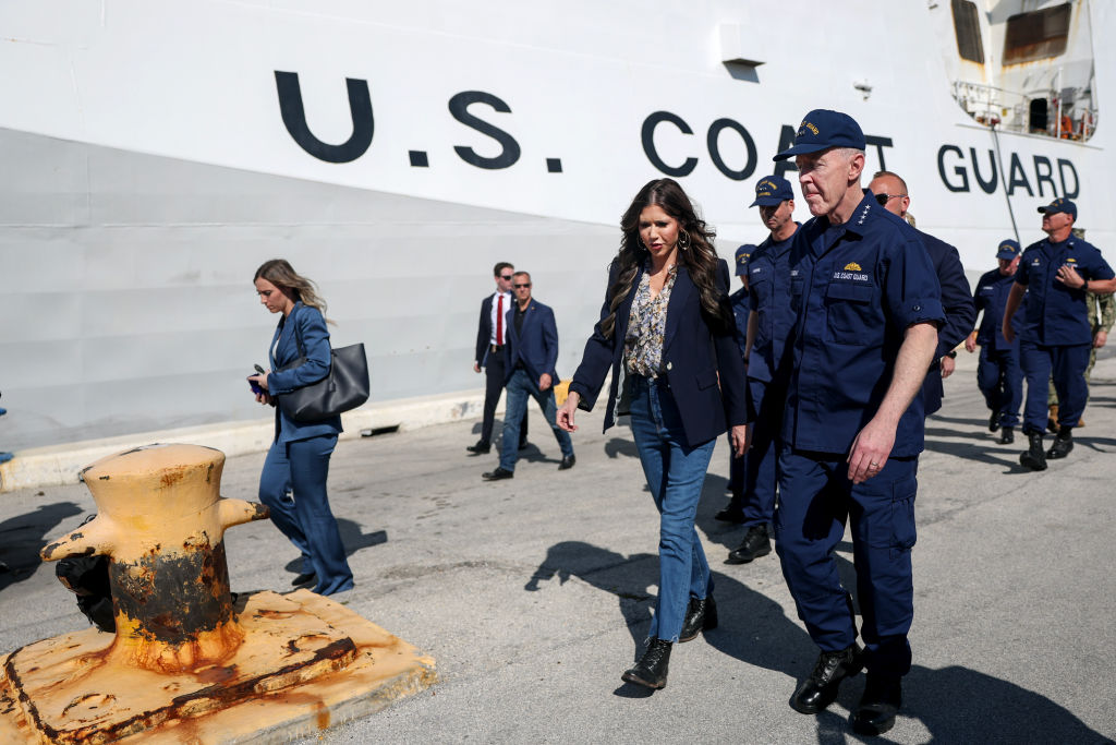PORT EVERGLADES, FLORIDA - MARCH 20: Department of Homeland Security Secretary Kristi Noem walks with Admiral Kevin E. Lunday (R), Acting Commandant, U.S. Coast Guard, before holding a press conference after packages of cocaine and marijuana had been offloaded from U.S. Coast Guard Cutter Stone at Port Everglades on March 20, 2025 in Port Everglades, Florida. The U.S. Coast Guard offloaded approximately 45,600 pounds of illicit narcotics worth more than $517.5 million, the results of 14 interdictions by the crews of U.S. Coast Guard cutters Stone and Mohawk. (Photo by Joe Raedle/Getty Images)