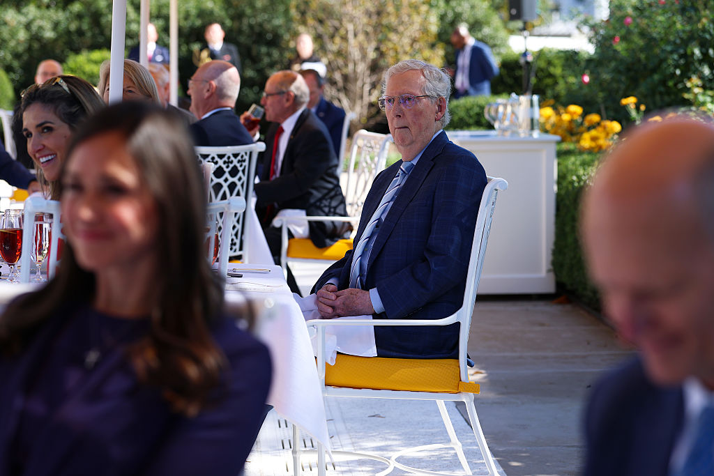 WASHINGTON, DC - OCTOBER 21: U.S. Sen. Mitch McConnell (R-KY) listens as U.S. President Donald Trump delivers remarks during a luncheon in the Rose Garden of the White House on October 21, 2025 in Washington, DC. President Trump hosted the