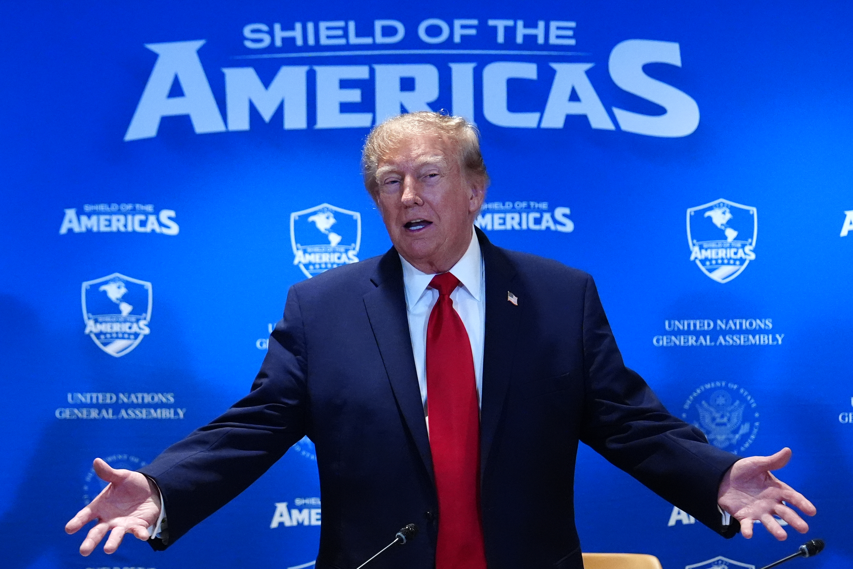President Donald Trump arrives for a meeting of the multinational political and security coalition