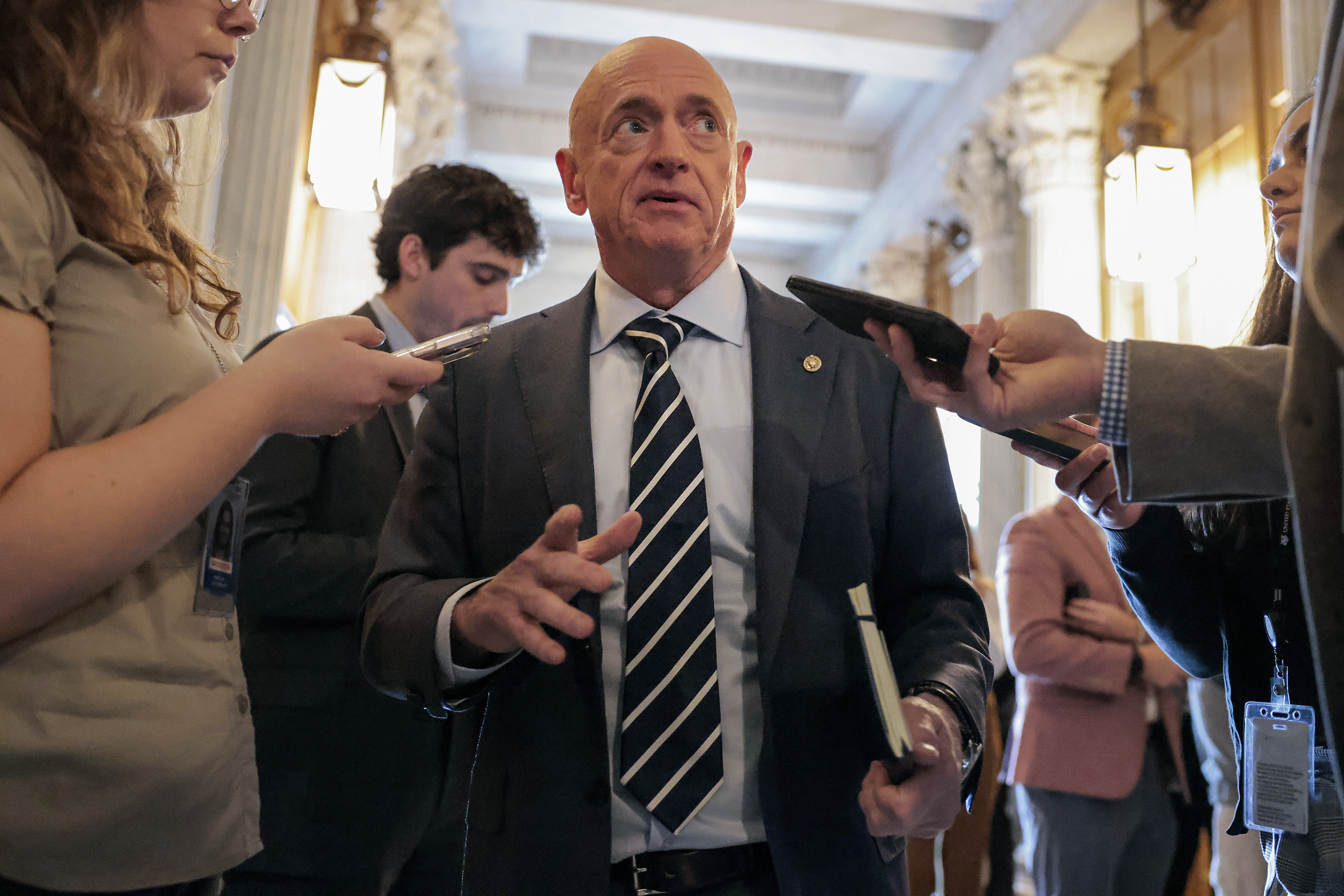 WASHINGTON, DC - FEBRUARY 25: Sen. Mark Kelly (D-AZ) speaks with media in the U.S. Capitol on February 25, 2026 in Washington, DC. Kelly attended President Donald Trump's State of the Union despite other Democrats boycotting. (Photo by Heather Diehl/Getty Images)