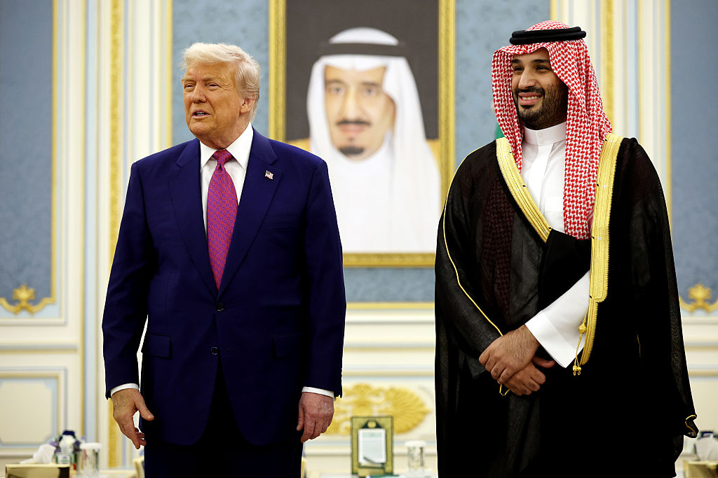 RIYADH, SAUDI ARABIA - MAY 13: U.S. President Donald Trump and Saudi Crown Prince Mohammed bin Salman interact with officials during a “coffee ceremony” at the Saudi Royal Court on May 13, 2025, in Riyadh, Saudi Arabia. Trump begins a multi-nation tour of the Gulf region focused on expanding economic ties and reinforcing security cooperation with key U.S. allies.  (Photo by Win McNamee/Getty Images)