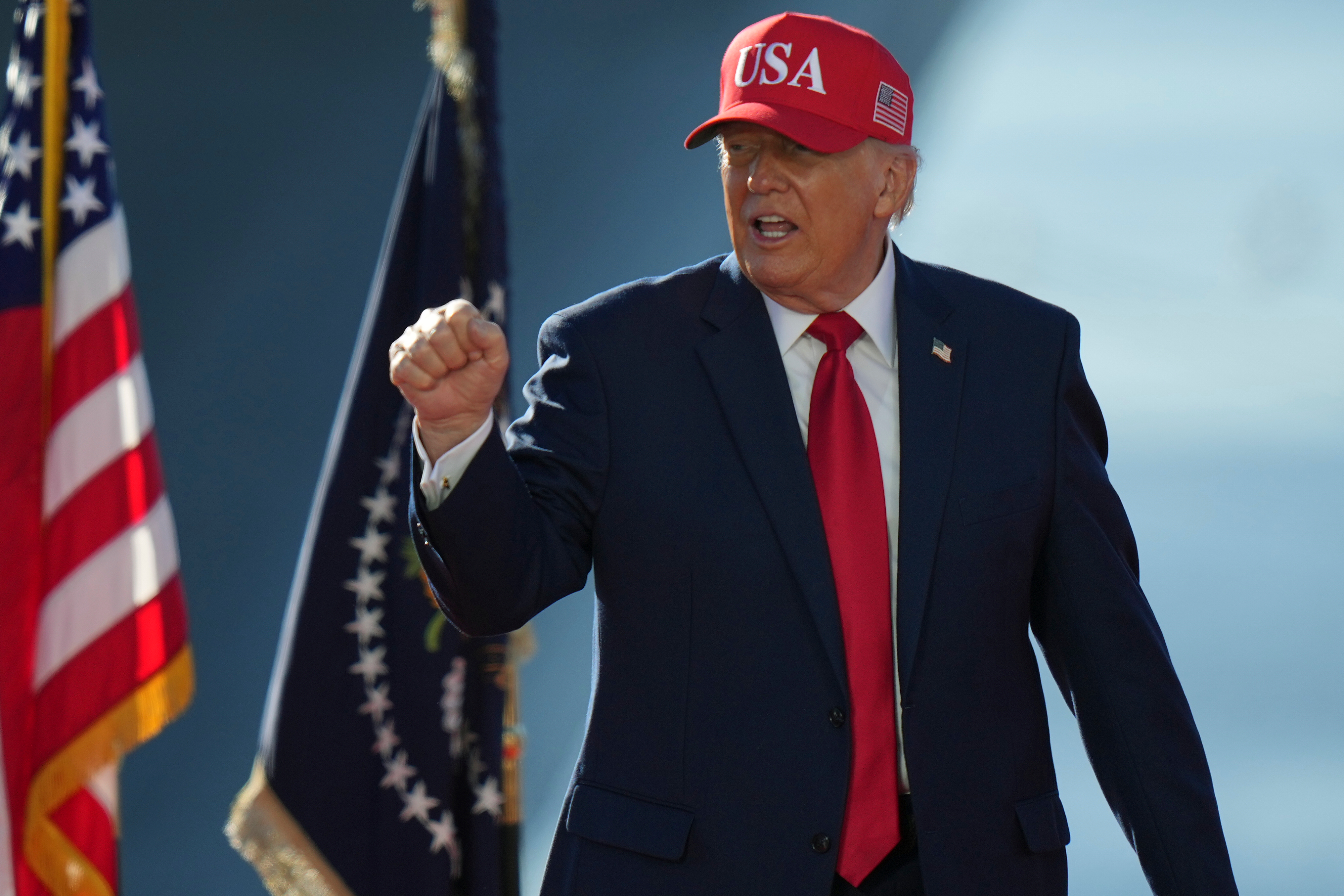 President Donald Trump raises his fist toward someone in the crowd at an event for Anduril Industries, Inc., at Sparrows Point Shipyard, Tuesday, Oct. 6, 2026, in Sparrows Point, Md. (AP Photo/Stephanie Scarbrough)