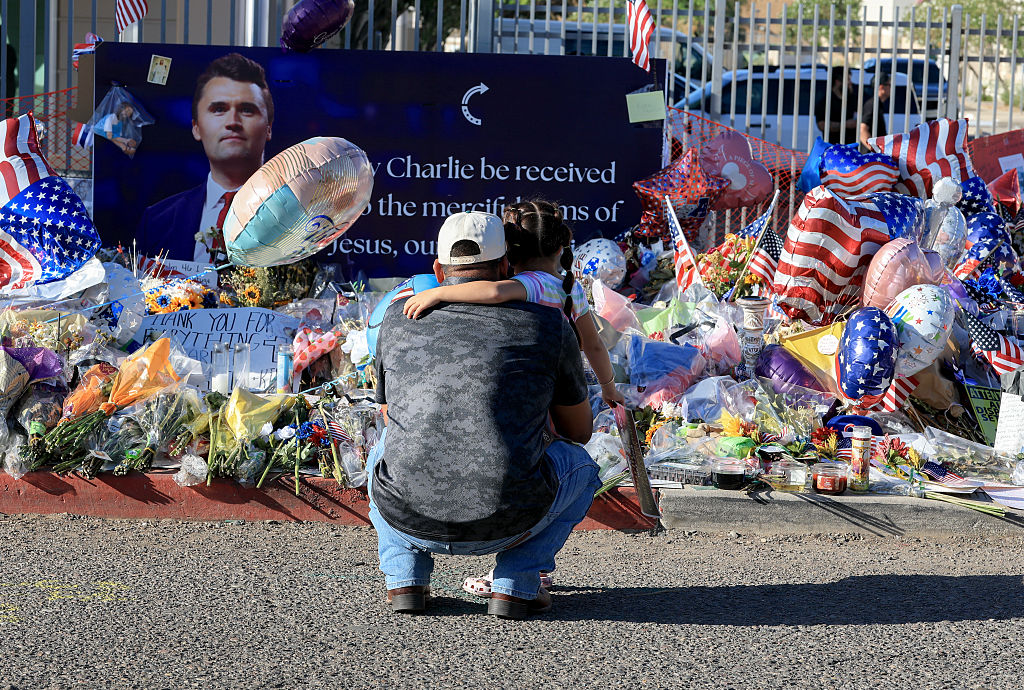 PHOENIX, ARIZONA - SEPTEMBER 16:  People visit the makeshift memorial for Charlie Kirk outside of the headquarters of Turning Point USA on September 16, 2025 in Phoenix, Arizona. Kirk, the CEO and co-founder of Turning Point USA, was shot and killed on September 10th while speaking at an event for his