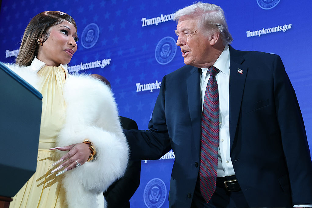 WASHINGTON, DC - JANUARY 28: Musician Nicki Minaj (L) joins U.S. President Donald Trump on stage during the Treasury Department's Trump Accounts Summit at Andrew W. Mellon Auditorium on January 28, 2026 in Washington, DC.