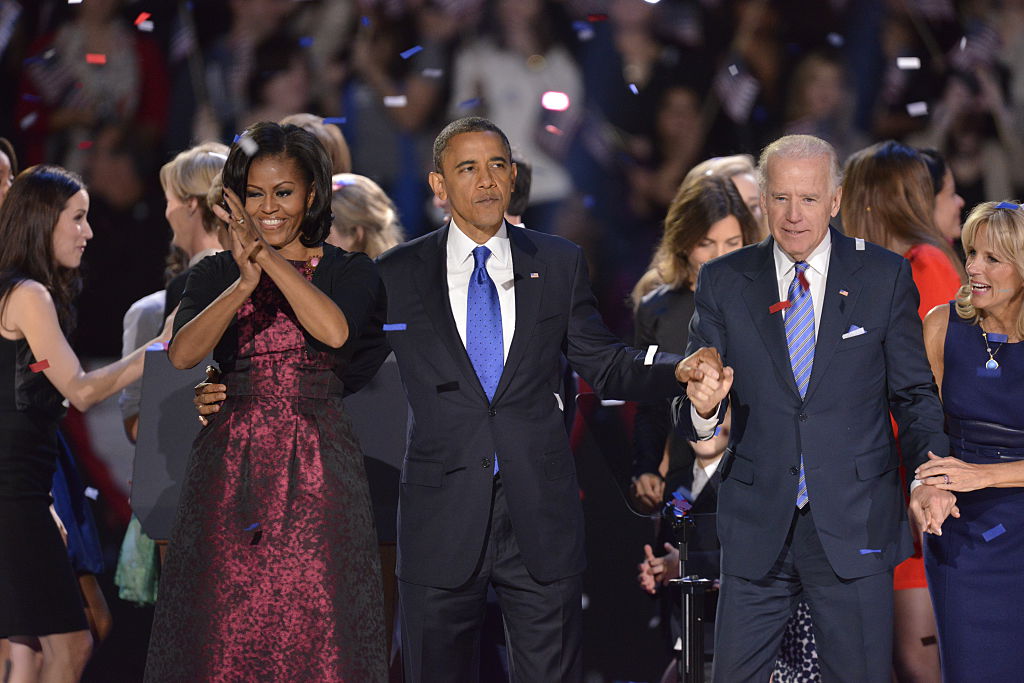 President Barack Obama, his wife Michele and Vice President Joe Biden and his wife Jill wave to supporters in Chicago at an election day watch party in the McCormick Place convention center. (Photo by Ralf-Finn Hestoft/Corbis via Getty Images)