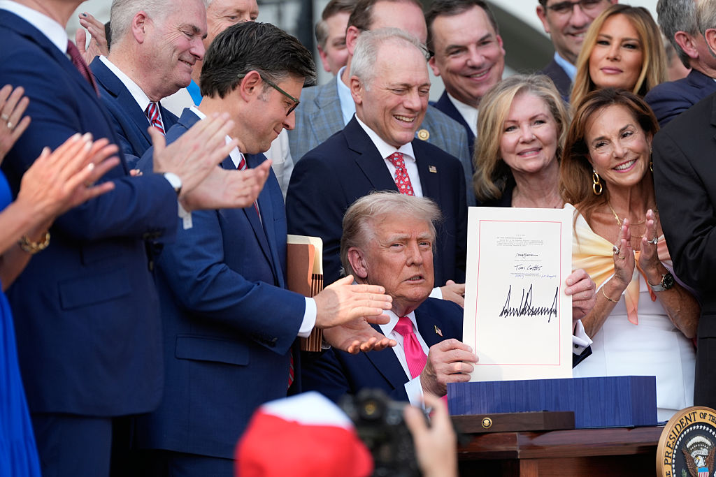WASHINGTON, DC - JULY 04: President Donald Trump holds up the