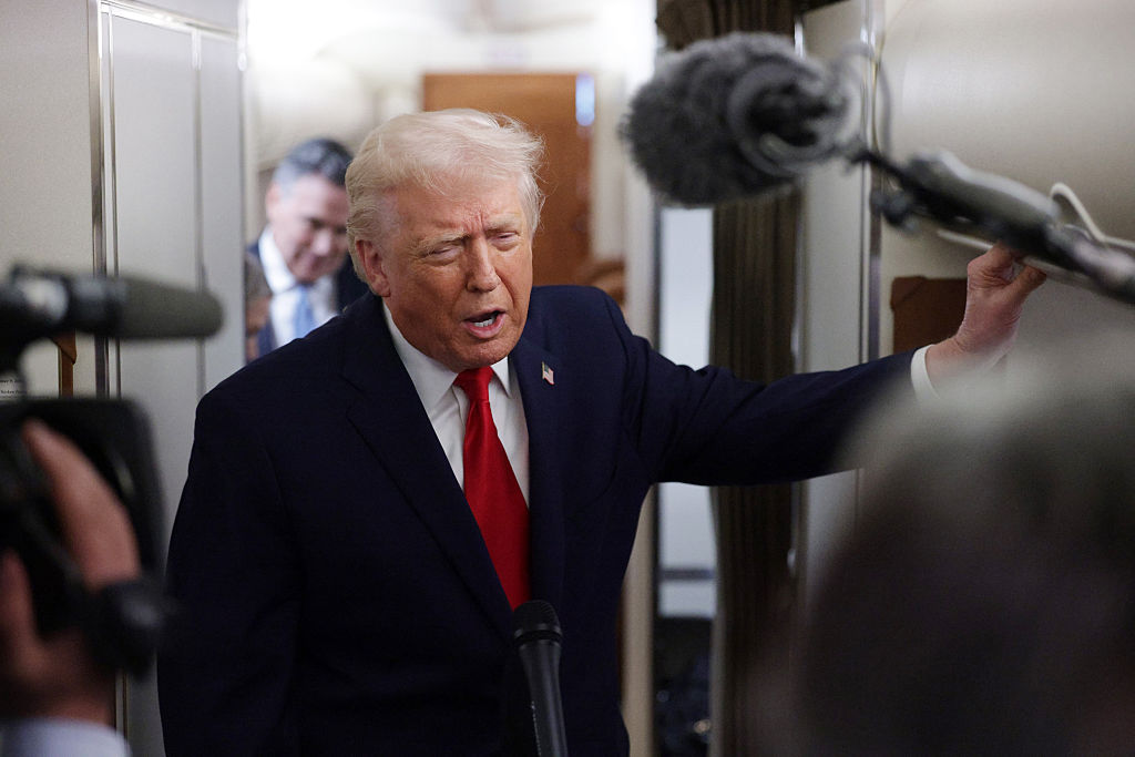IN FLIGHT - DECEMBER 09: U.S. President Donald Trump speaks to the media aboard Air Force One enroute to Pennsylvania on December 9, 2025. Trump is scheduled to deliver remarks on his administration's economic agenda at an event in Mount Pocono. (Photo by Alex Wong/Getty Images)