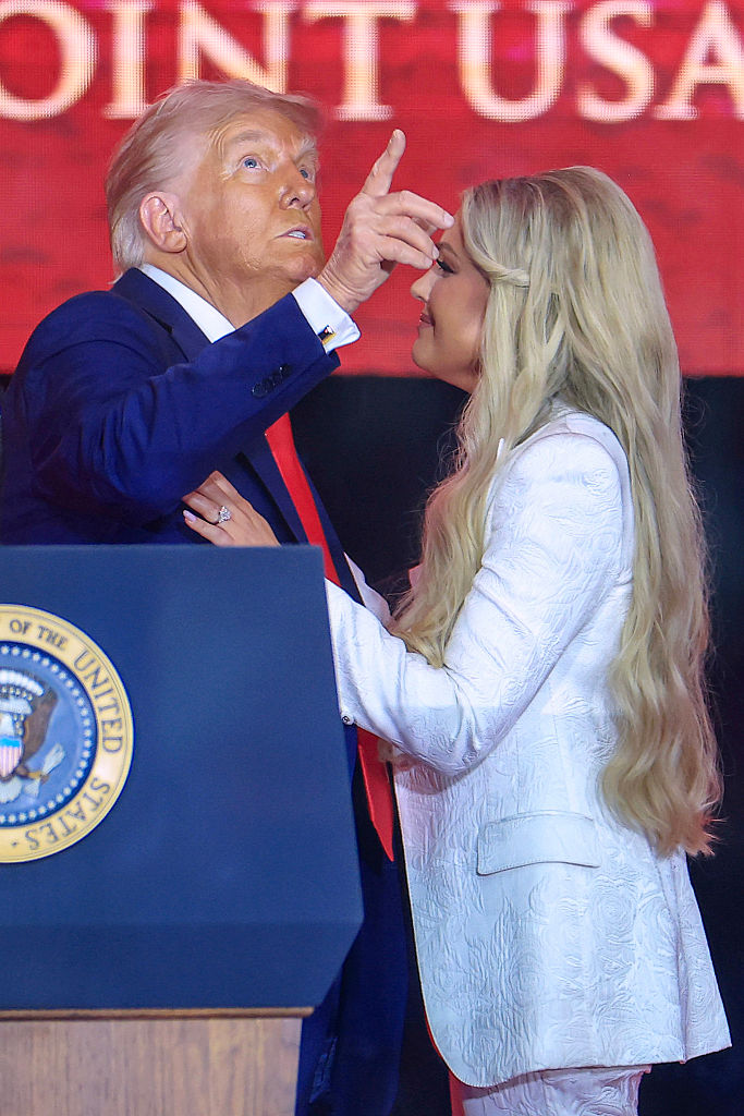 GLENDALE, ARIZONA - SEPTEMBER 21: Mrs. Erika Kirk joins U.S. President Donald Trump onstage during the memorial service for political activist Charlie Kirk at State Farm Stadium on September 21, 2025 in Glendale, Arizona. Kirk, the CEO and co-founder of Turning Point USA, was shot and killed on September 10th while speaking at an event during his