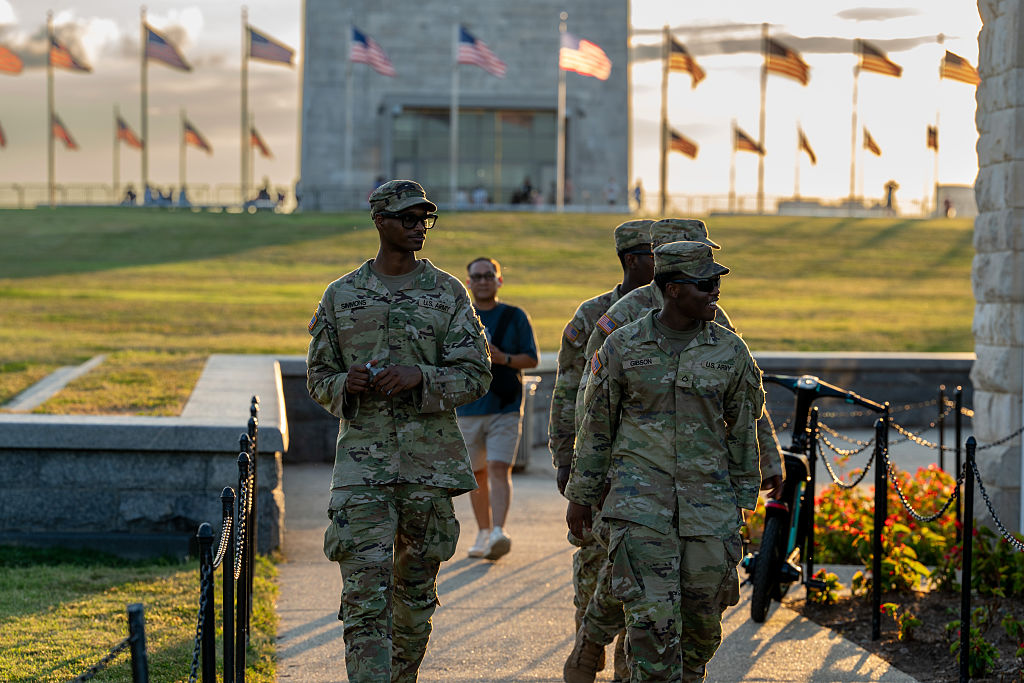 WASHINGTON, DC - AUGUST 12: National Guard troops are deployed to the Washington Monument as part of President Trump's mobilization of law enforcement on August 12, 2025 in Washington, DC. The Trump Administration placed the DC Metropolitan Police Department under federal control and deployed federal officers and the National Guard to the District to assist in crime prevention in the nation’s capital. (Photo by Andrew Leyden/Getty Images)