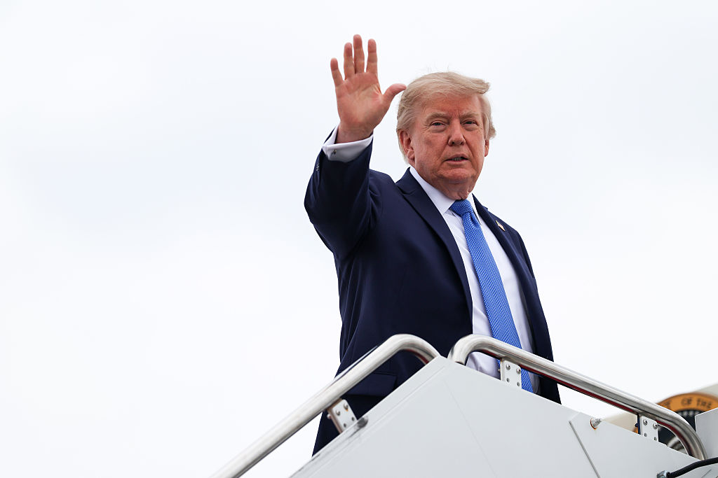 JOINT BASE ANDREWS, MARYLAND - AUGUST 14: U.S. President Donald Trump waves as he boards Air Force One on August 14, 2026 at Joint Base Andrews, Maryland. Trump is traveling to Long Island to tour law enforcement facilities in Nassau County and rally support for local Republican candidates ahead of the upcoming midterm elections. (Photo by Samuel Corum/Getty Images)