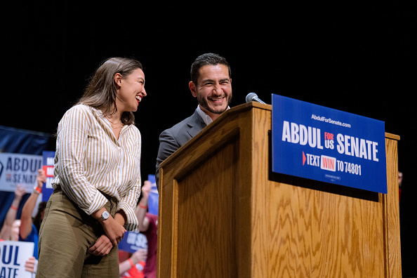 Representative Alexandria Ocasio-Cortez, a Democrat from New York, left, and Abdul El-Sayed, US Democratic Senate candidate from Michigan, laugh during the