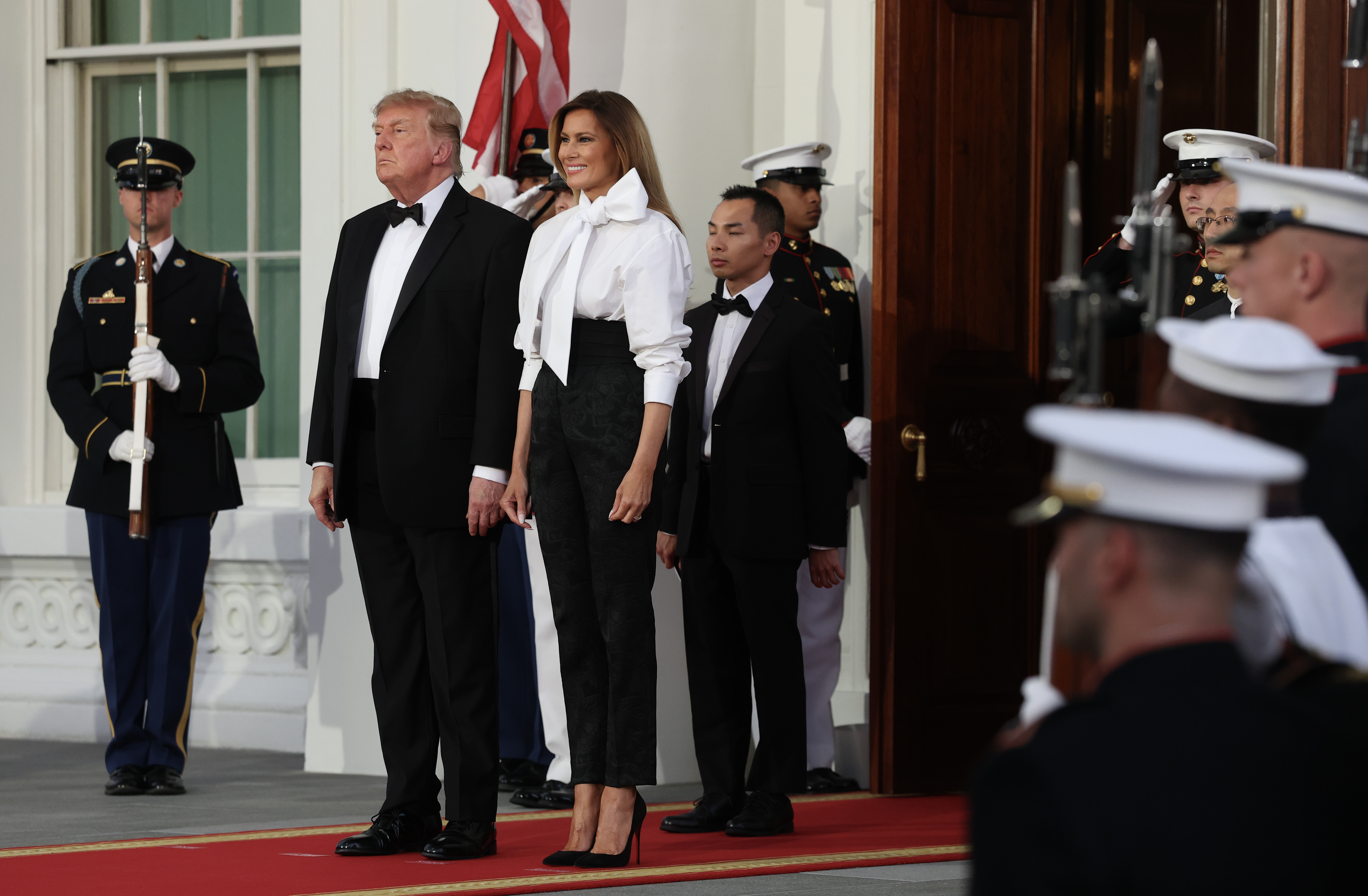 WASHINGTON, DC - SEPTEMBER 24:  U.S. President Donald Trump and first lady Melania Trump await the arrival of Chinese President Xi Jinping and first lady Peng Liyuan for a state dinner in the East Room of the White House on September 24, 2026 in Washington, DC. Trump is hosting Xi for a three-day state visit to Washington, DC, where the leaders were expected to discuss trade practices, artificial intelligence and the furthering&nbsp;of