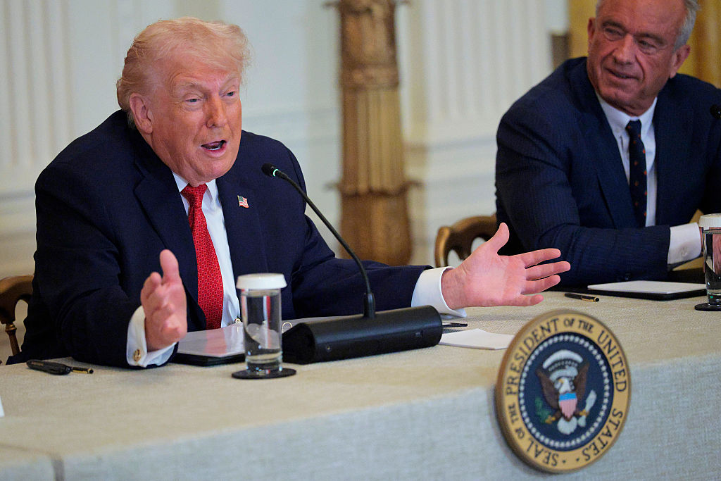 WASHINGTON, DC - JANUARY 16: U.S. President Donald Trump (L) speaks as U.S. Secretary of Health and Human Services Robert F. Kennedy Jr. looks on during a