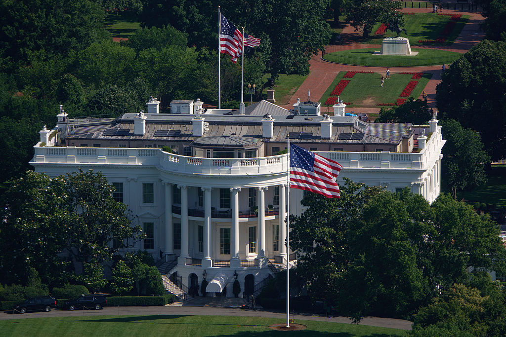 WASHINGTON, DC - JUNE 19: U.S. flags fly at the top of newly installed 100-foot-tall poles on the South and North Lawns of the White House on June 19, 2025 in Washington, DC. U.S. President Donald Trump had the two flagpoles installed on the White House grounds as part of a