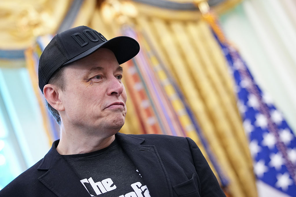 WASHINGTON, DC - MAY 30: Tesla CEO Elon Musk listens as U.S. President Donald Trump speaks to reporters in the Oval Office of the White House on May 30, 2025 in Washington, DC. Musk, who served as an adviser to Trump and led the Department of Government Efficiency, announced he would leave his role the Trump administration to refocus on his businesses. (Photo by Kevin Dietsch/Getty Images)