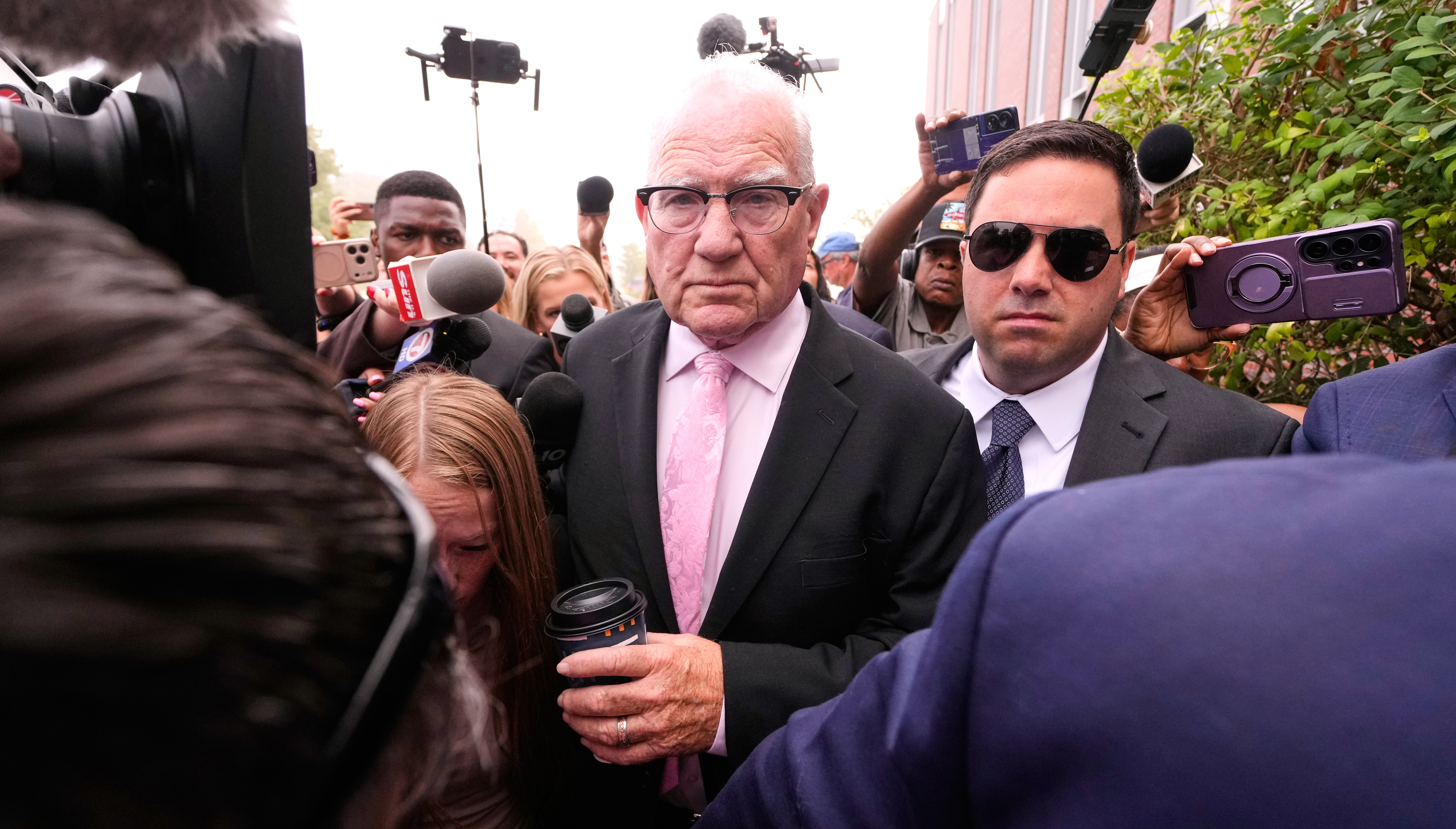 Kevin Reddington, defense attorney for Lindsay Clancy, walks through reporters and television cameras while arriving at Plymouth County Superior Court, Friday, Sept. 4, 2026, in Plymouth, Mass. (AP Photo/Charles Krupa)