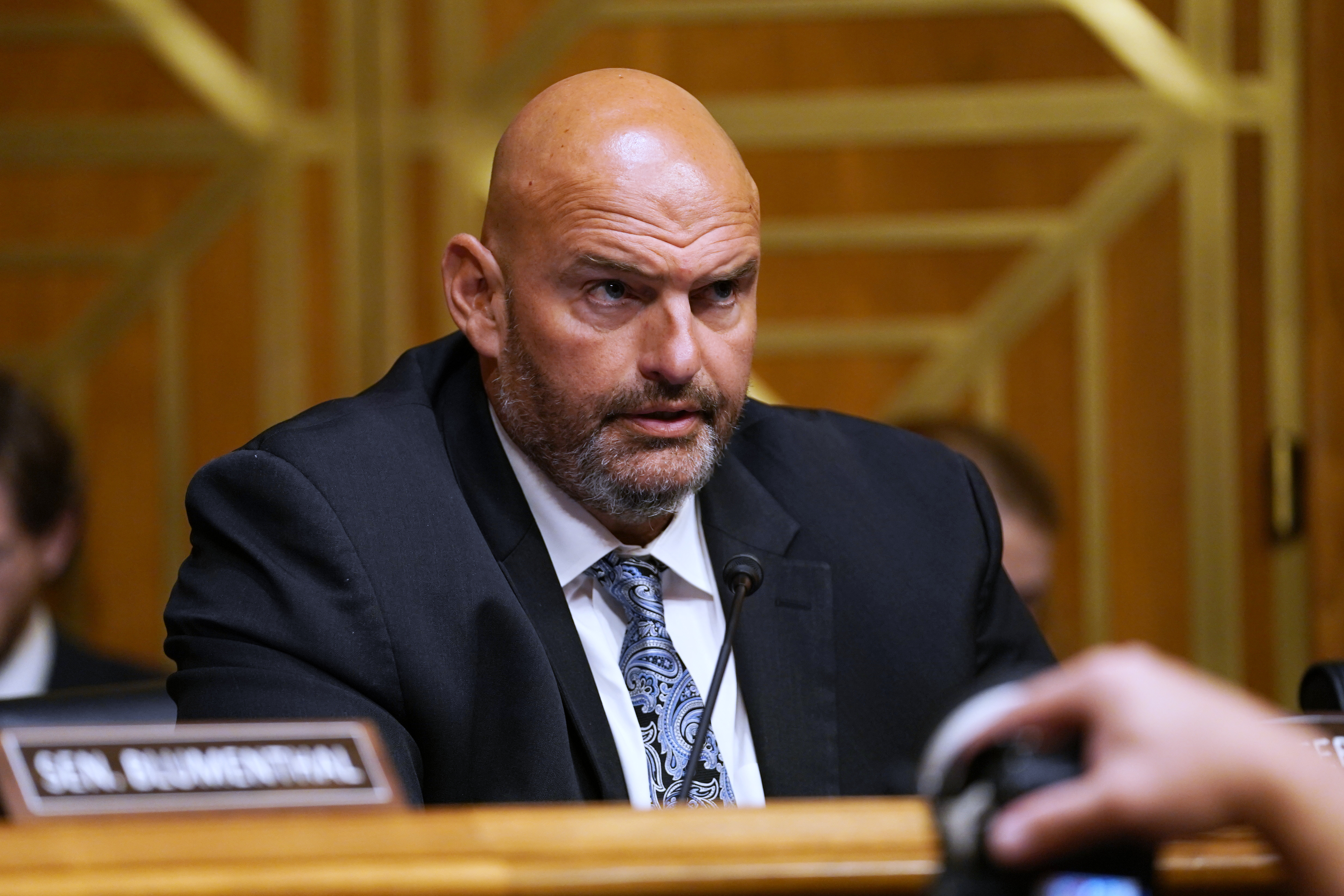 Sen. John Fetterman, D-Pa., speaks as Dr. Anthony Fauci appears before the Senate Homeland Security and Governmental Affairs Committee at the Capitol, Wednesday, July 29, 2026, in Washington. (AP Photo/Allison Robbert)