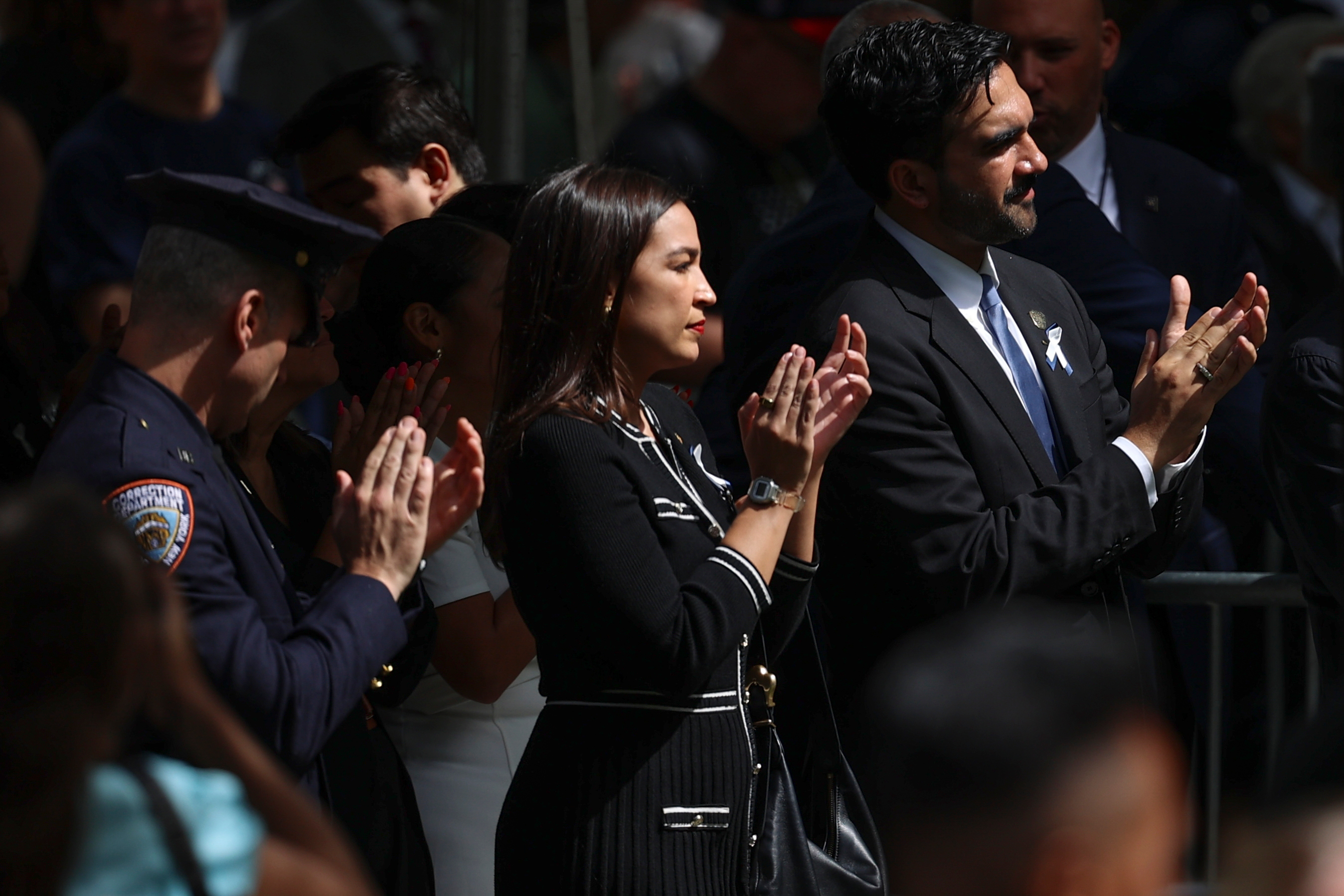 U.S. Rep. Alexandria Ocasio-Cortez, D-N.Y., and New York City Mayor Zohran Mamdani participate in a memorial on the 25th anniversary of the September 11, 2001, terrorist attacks, Friday, Sept. 11, 2026, in New York. (AP Photo/Pamela Smith)