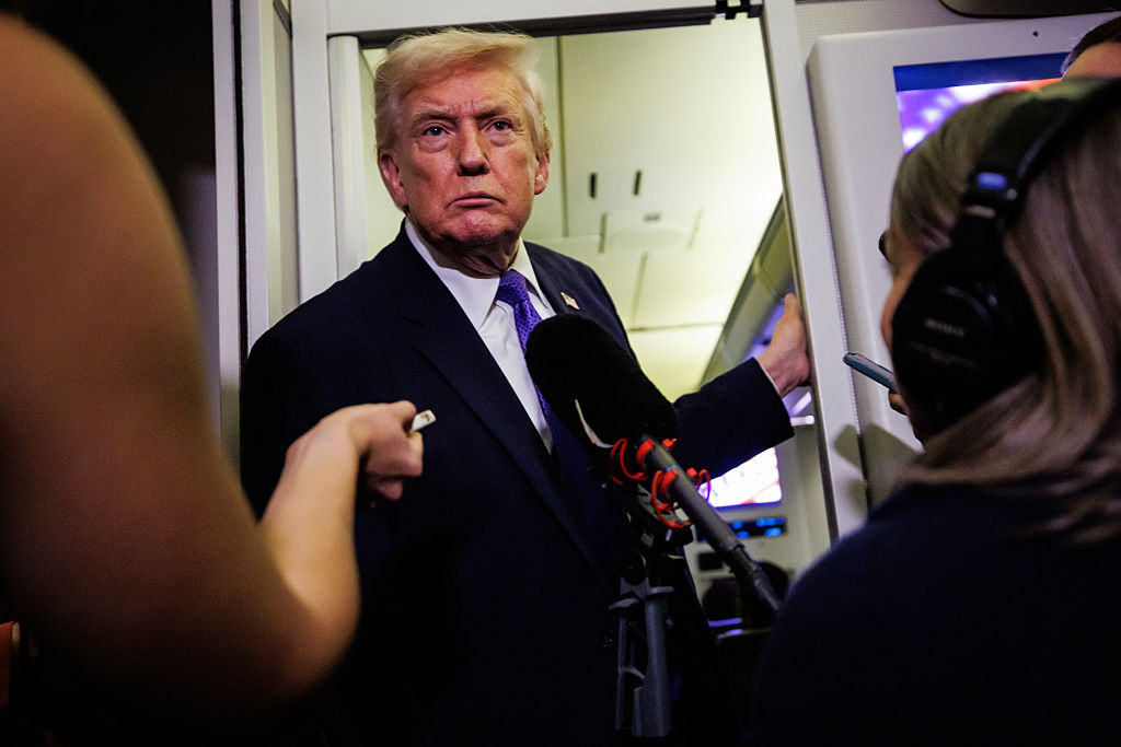 PALM BEACH, FLORIDA - FEBRUARY 6: U.S. President Donald Trump gaggles with reporters while in-flight aboard Air Force One on February 6, 2026 in Palm Beach, Florida. The President is spending the weekend at Mar-a-Lago, his private club. (Photo by Samuel Corum/Getty Images) *** Local Caption *** Donald Trump