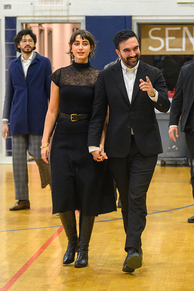 NEW YORK, NEW YORK - NOVEMBER 04:  Democratic Mayoral Candidate Zohran Mamdani (R) and his wife, Rama Duwaji (L), votes at The Frank Sinatra School of the Arts on November 04, 2025 in the Queens borough of New York City. Voters in NYC are voting for who will be replacing Mayor Eric Adams between the front runner New York Mayoral Candidate Zohran Mamdani and New York City mayoral candidate Andrew Cuomo and Republican mayoral candidate Curtis Sliwa. More than 735,000 people have voted early, according to the Board of Elections, more than four times as many as in the 2021 contest. This election also has other city offices on the ballot, as well as six proposals. (Photo by Alexi J. Rosenfeld/Getty Images)