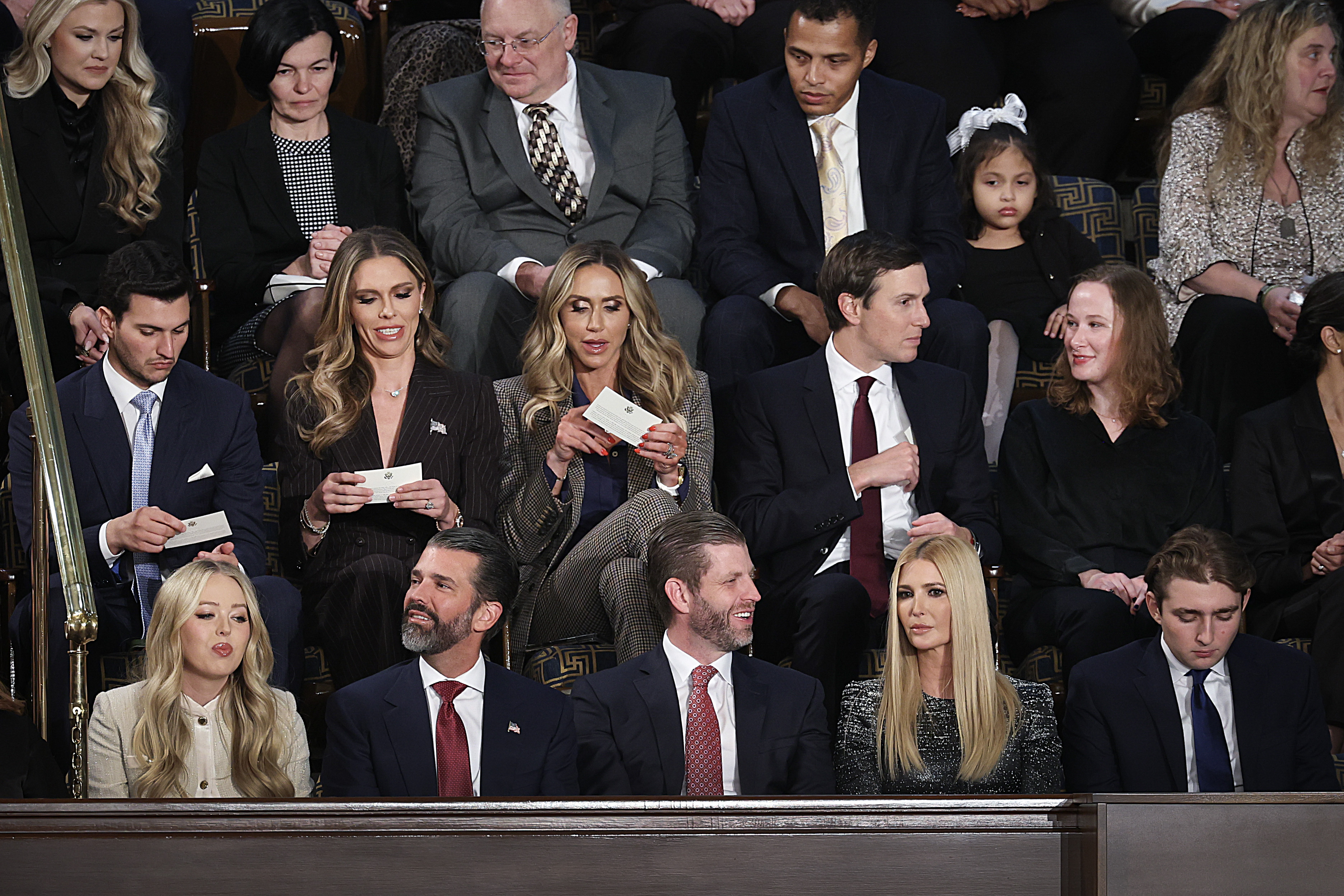 WASHINGTON, DC - FEBRUARY 24: Trump family members (top row L-R) Bettina Anderson, LaraTrump Jared Kuschner and (bottom row L to R) Tiffany Trump, Donald Trump Jr, Eric Trump, Ivanka Trump, and Barron Trump attend the State of the Union address during a Joint Session of Congress at the U.S. Capitol on February 24, 2026, in Washington, DC. Trump delivered his address days after the Supreme Court struck down the administration's tariff strategy and amid a U.S. military buildup in the Persian Gulf threatening Iran. (Photo by Win McNamee/Getty Images)