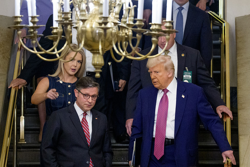 WASHINGTON, DC - MAY 20: U.S. President Donald Trump (R), accompanied by White House press secretary Karoline Leavitt (L) and Speaker of the House Mike Johnson (R-LA) (2nd-L), arrives for a House Republican meetin`g at the U.S. Capitol on May 20, 2025 in Washington, DC. Trump joined conservative House lawmakers to help push through their budget bill after it advanced through the House Budget Committee on Sunday evening. (Photo by Andrew Harnik/Getty Images)
