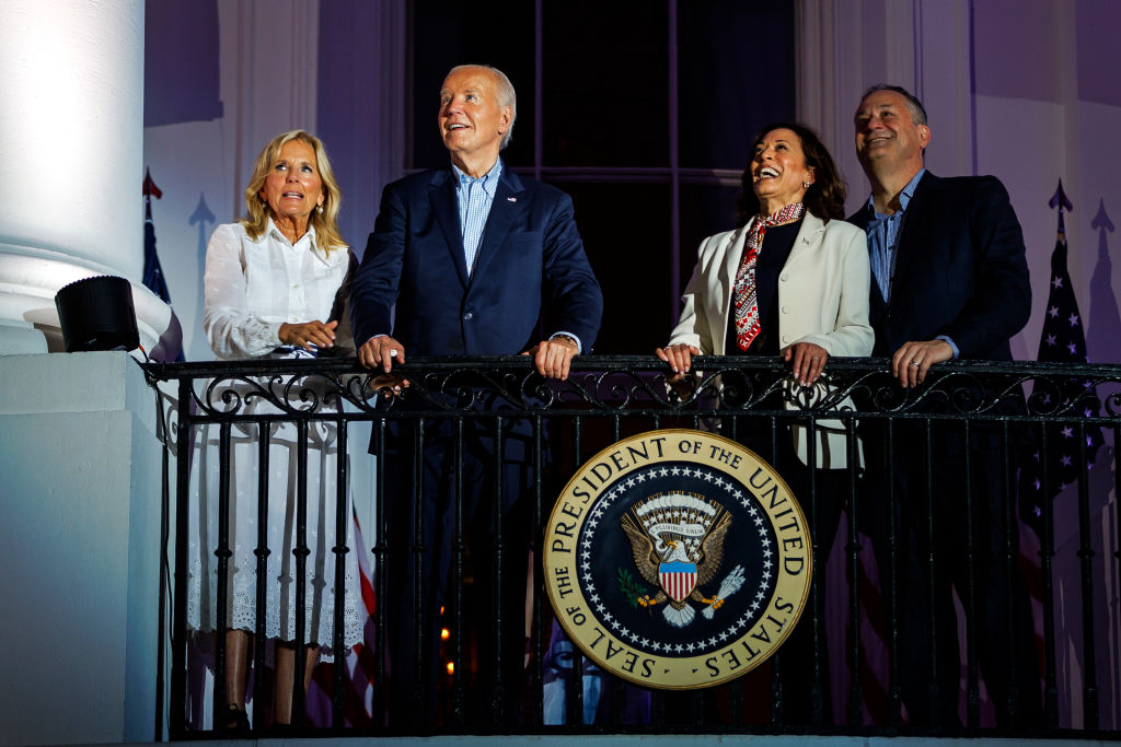 WASHINGTON, DC - JULY 4: President Joe Biden, First Lady Jill Biden, Vice President Kamala Harris, and Second Gentleman Doug Emhoff view the fireworks over the National Mall from the White House balcony during a 4th of July event on the South Lawn of the White House on July 4, 2024 in Washington, DC. The President is hosting the Independence Day event for members of the military and their families. (Photo by Samuel Corum/Getty Images) *** Local Caption *** Joe Biden; Jill Biden; Kamala Harris; Doug Emhoff