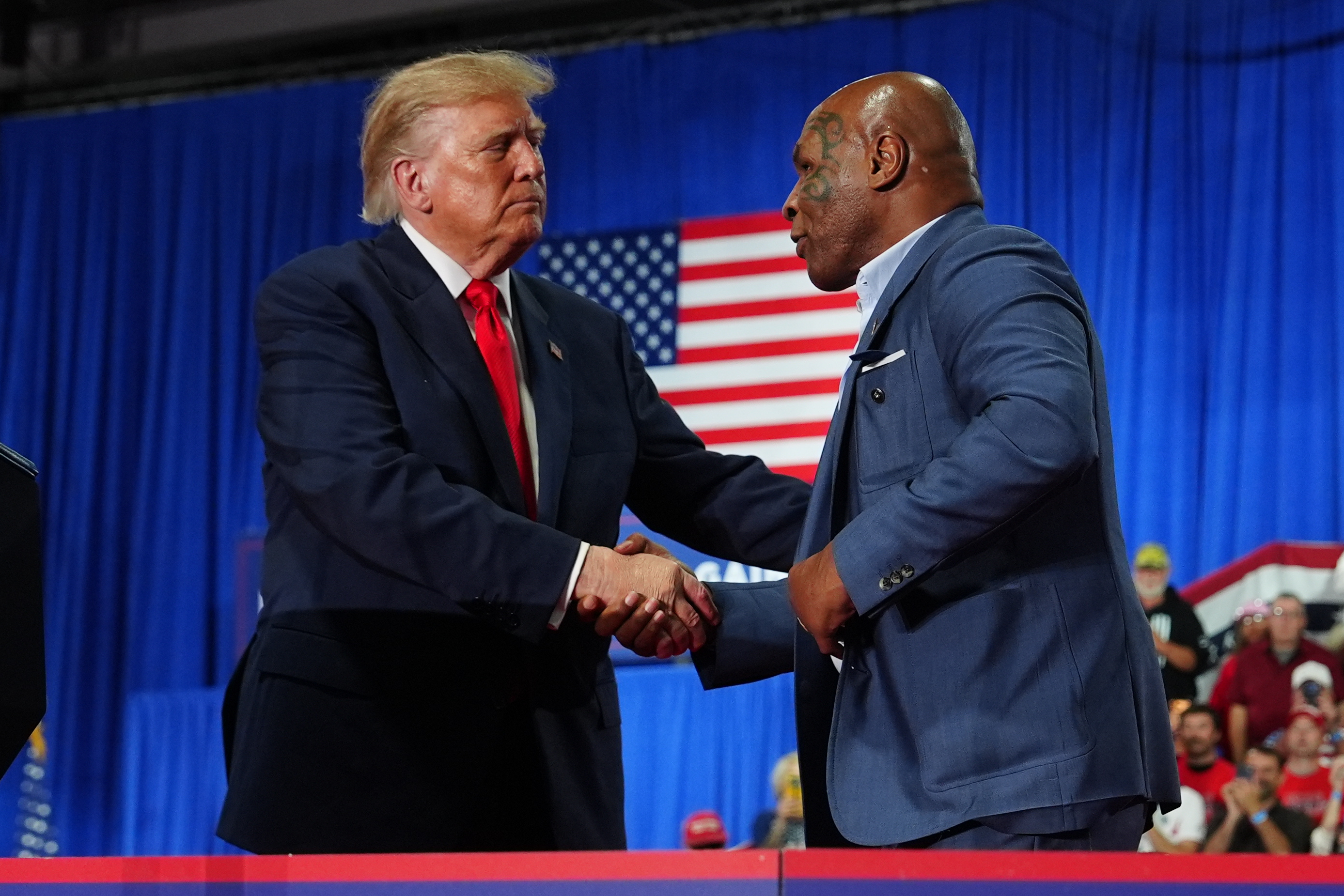 President Donald Trump greets Mike Tyson at a campaign rally at the Oncenter, Friday, Oct. 9, 2026, in Syracuse, N.Y. (AP Photo/Julia Demaree Nikhinson)