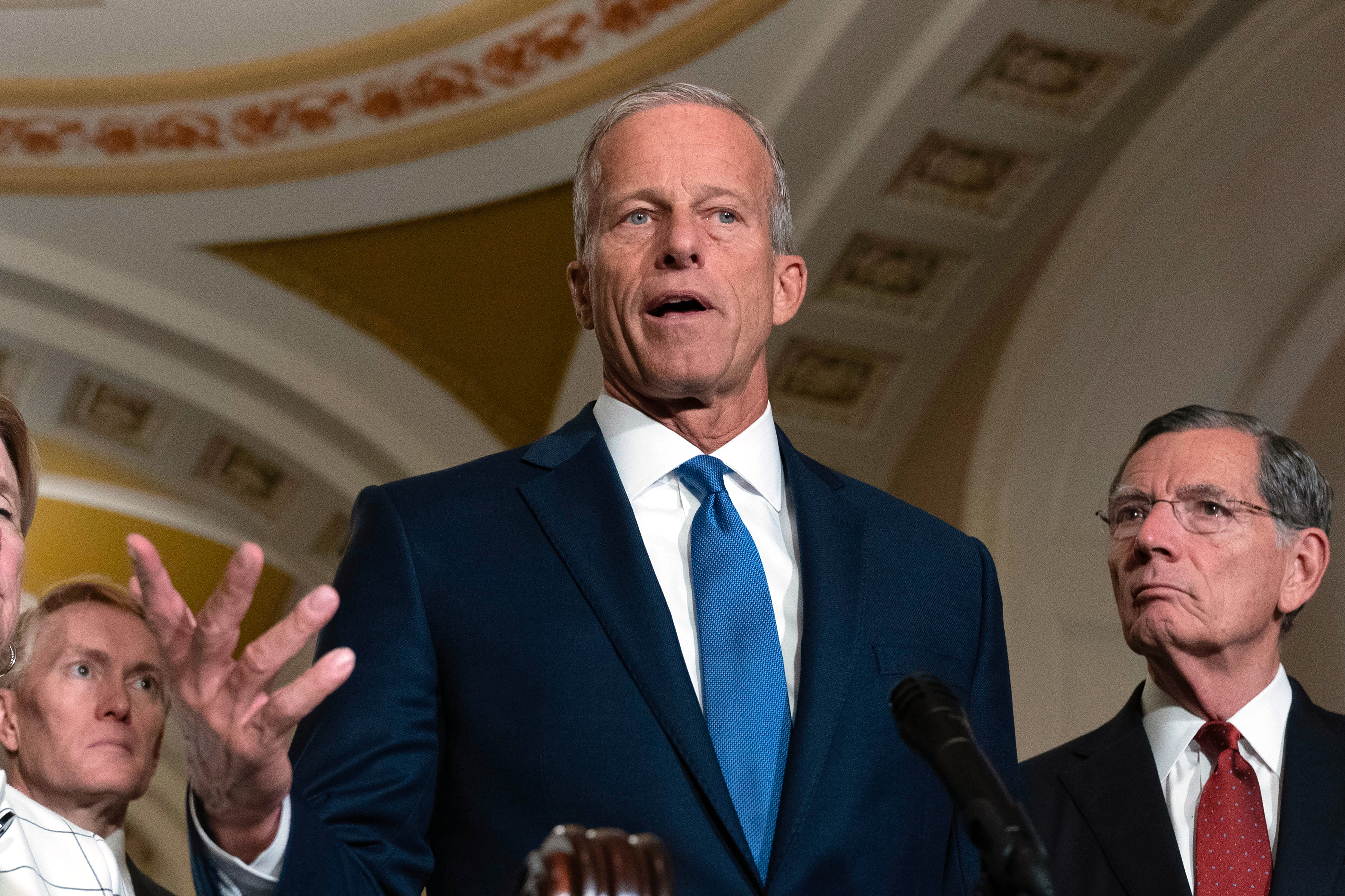 Senate Majority Leader John Thune, R-S.D., flanked by Sen. Shelley Moore Capito, R-W.Va., and Sen. John Barrasso, R-Wyo., speaks to reporters after a weekly Republican luncheon, at the Capitol Tuesday, Sept. 15, 2026, in Washington. (AP Photo/Jose Luis Magana)