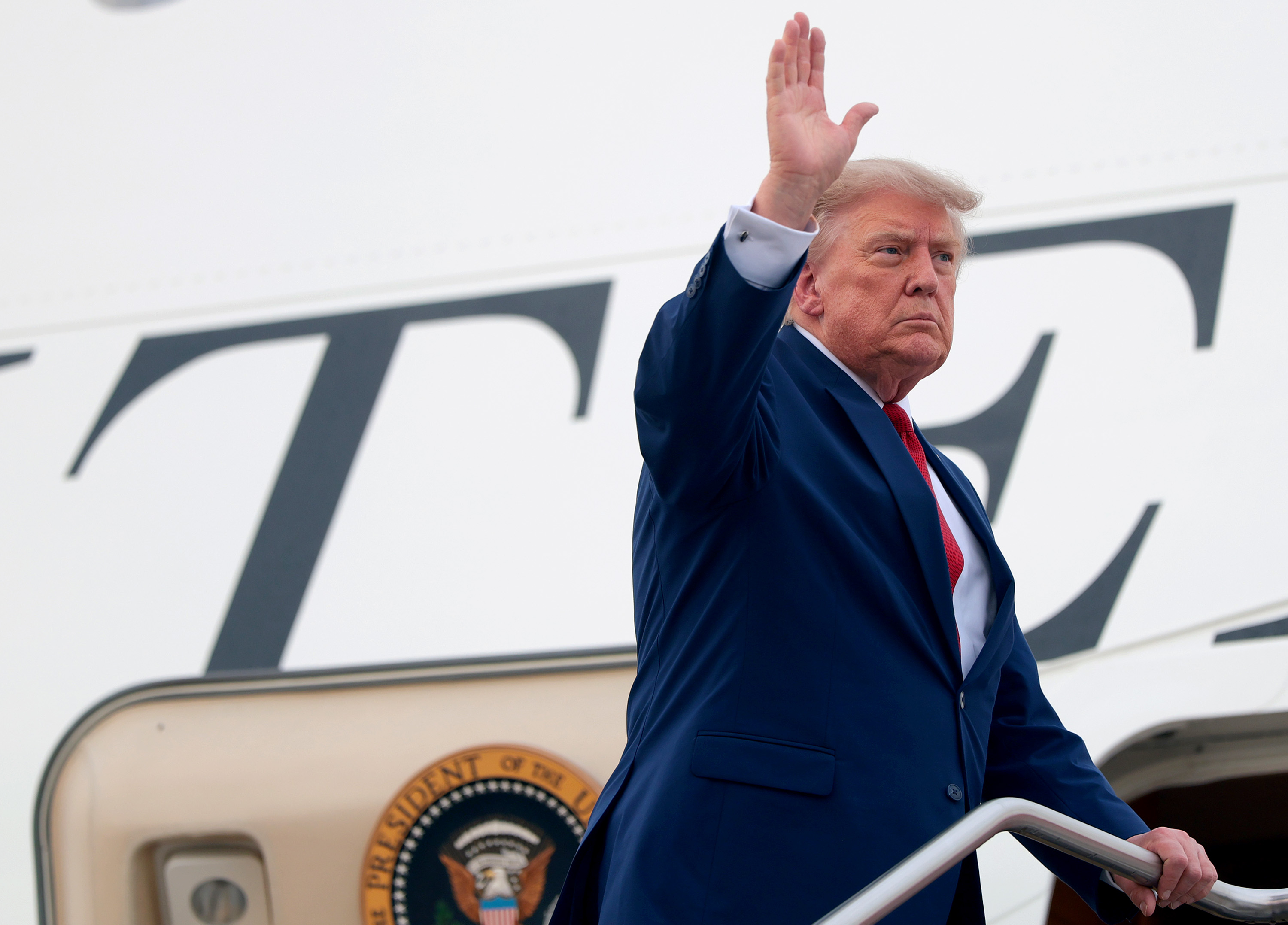 CLEVELAND, OHIO - AUGUST 11: U.S. President Donald Trump waves as he boards Air Force One at Cleveland Hopkins International Airport on August 11, 2026 in Cleveland, Ohio. President Trump is returning to Washington, DC after traveling to Ohio to attend the 2026 Patriot Games. (Photo by Anna Moneymaker/Getty Images)