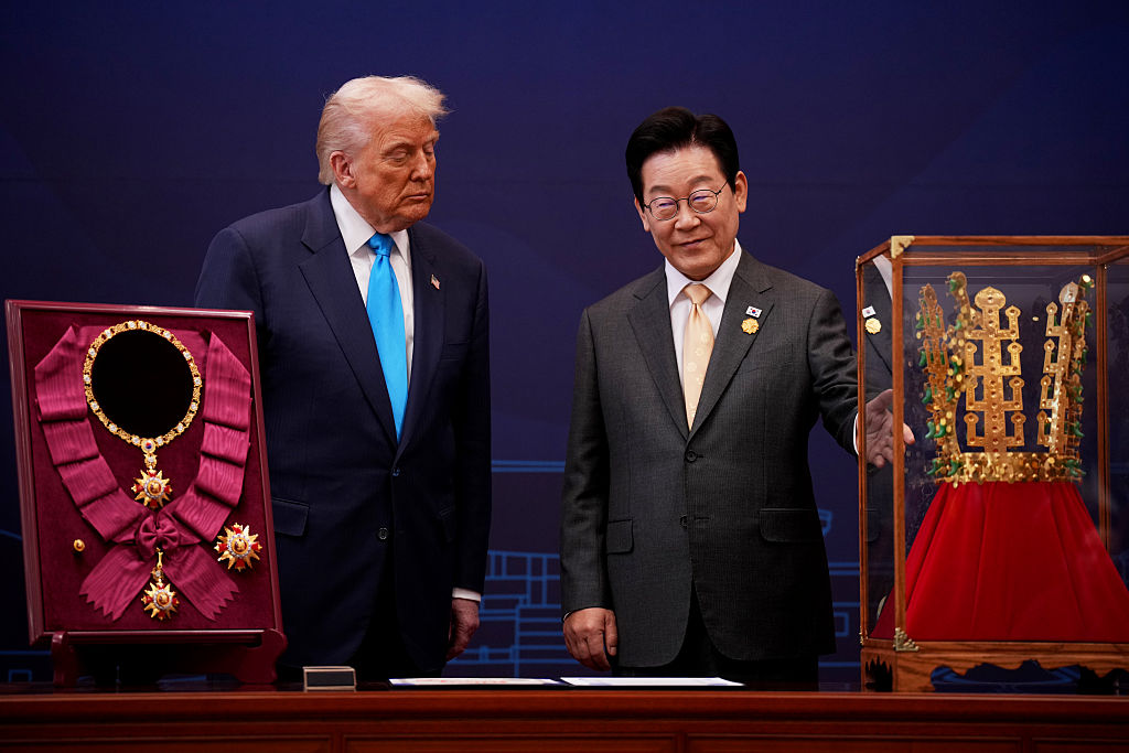 GYEONGJU, SOUTH KOREA - OCTOBER 29: U.S. President Donald Trump reacts as he is presented with the Grand Order of Mugunghwa and the Silla gold crown by South Korean President Lee Jae Myung at the Gyeongju National Museum on October 29, 2025 in Gyeongju, South Korea. Trump is in South Korea for the APEC meetings, following an appearance at the ASEAN summit in Malaysia, and a trip to Japan, where he called on Japanese Emperor Naruhito and new Prime Minister Sanae Takaichi. (Photo by Andrew Harnik/Getty Images)