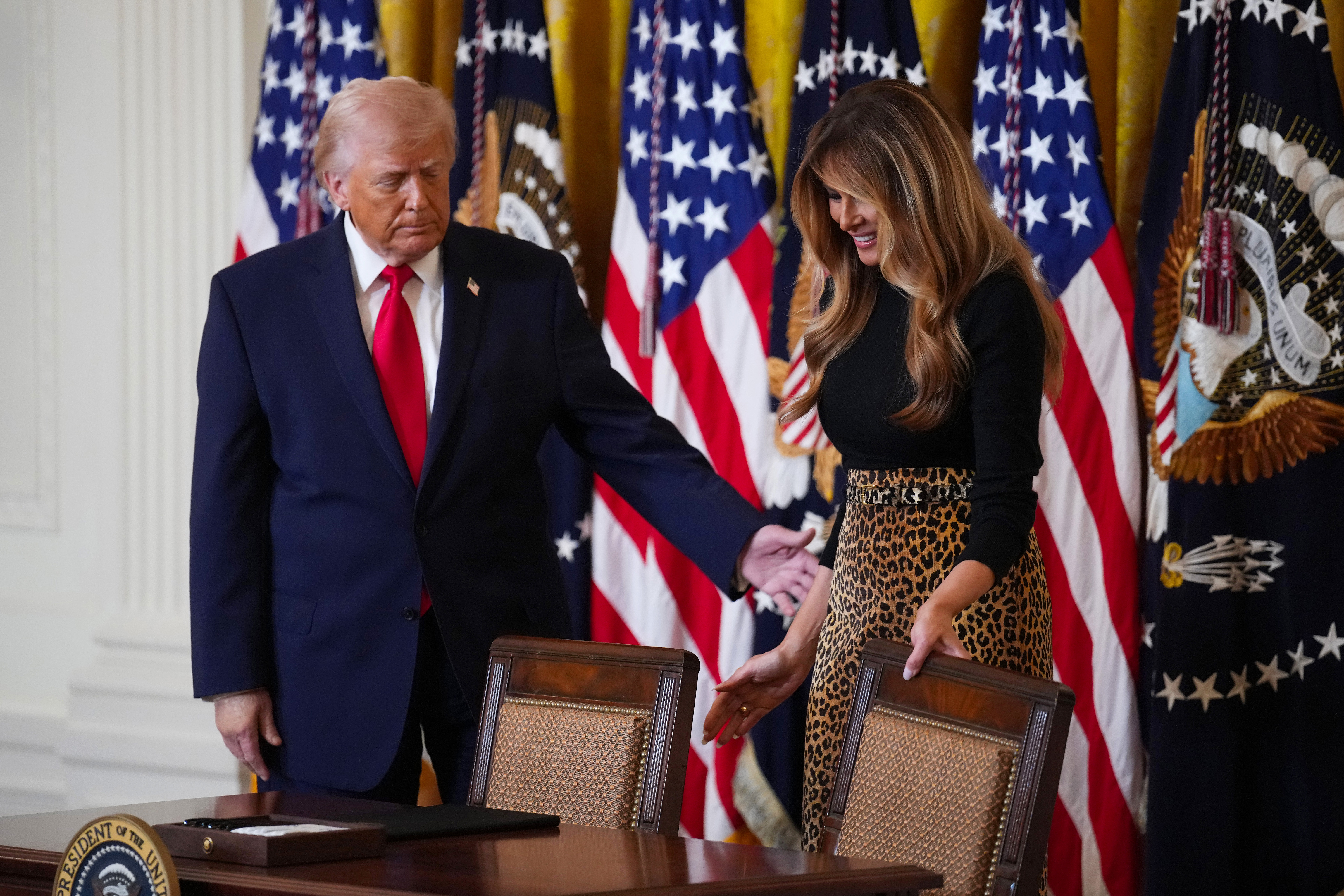 WASHINGTON, DC - MARCH 12: U.S. President Donald Trump and first lady Melania Trump attend a Women's History Month event in the East Room of the White House on March 12, 2026 in Washington, DC. The United States has observed Women's History Month in March since 1987. (Photo by Andrew Harnik/Getty Images)