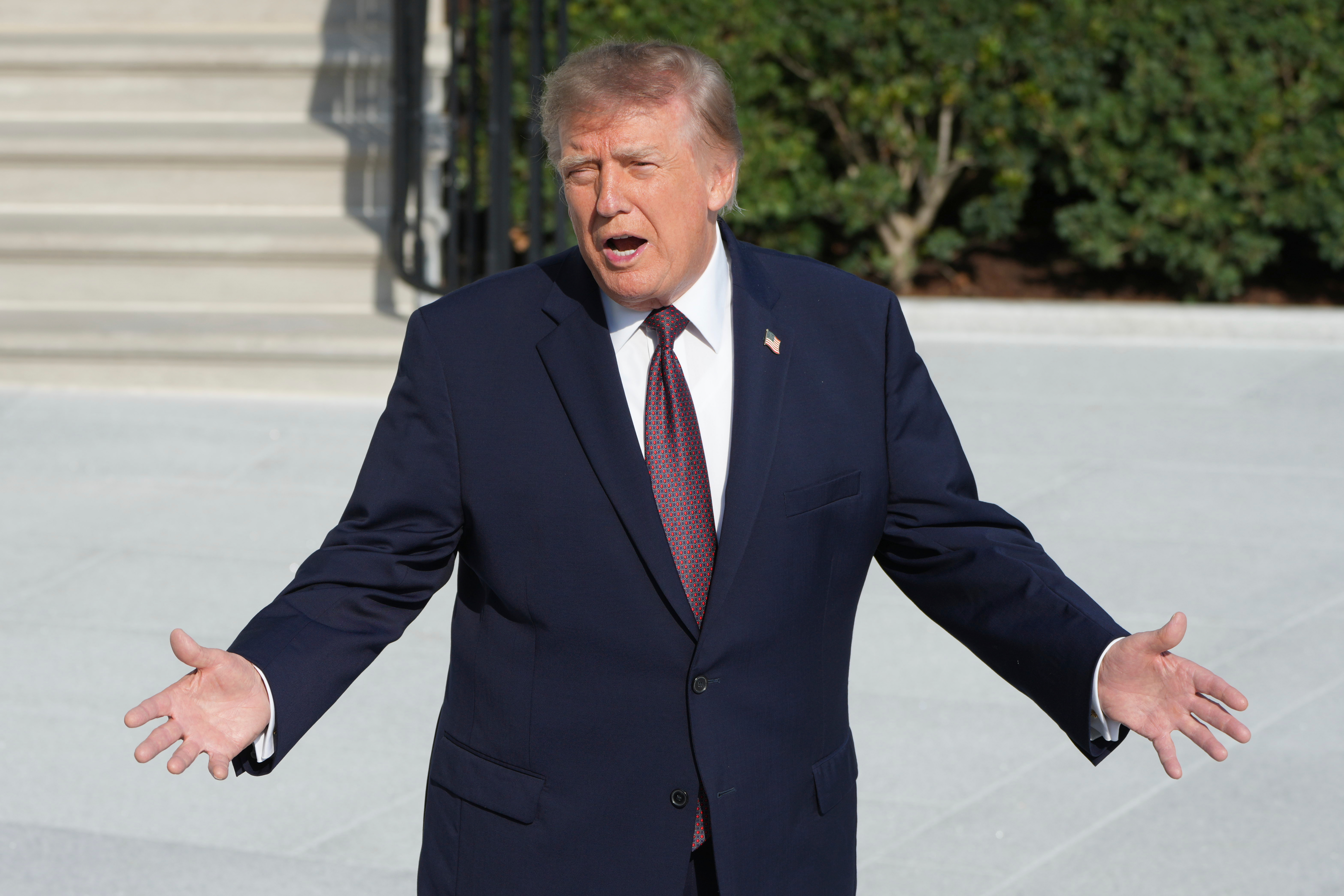 President Donald Trump speaks to reporters on the South Lawn of the White House before boarding Marine One, Friday, Oct. 2, 2026, in Washington. (AP Photo/Mark Schiefelbein)