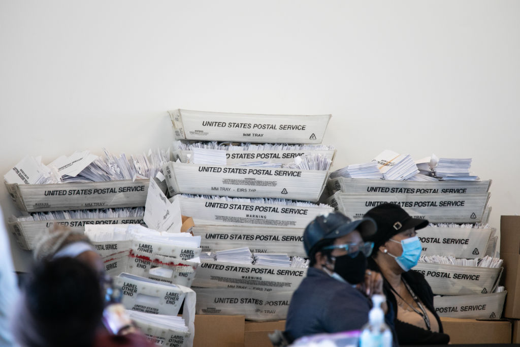 ATLANTA, GA - NOVEMBER 06: Security envelopes for absentee ballots sit in stacked boxes as Fulton county workers continue to count absentee ballots at State Farm Arena on November 6, 2020 in Atlanta, Georgia. The 2020 presidential race between incumbent U.S. President Donald Trump and Democratic nominee Joe Biden is still too close to call with outstanding ballots in a number of states including Georgia. (Photo by Jessica McGowan/Getty Images)