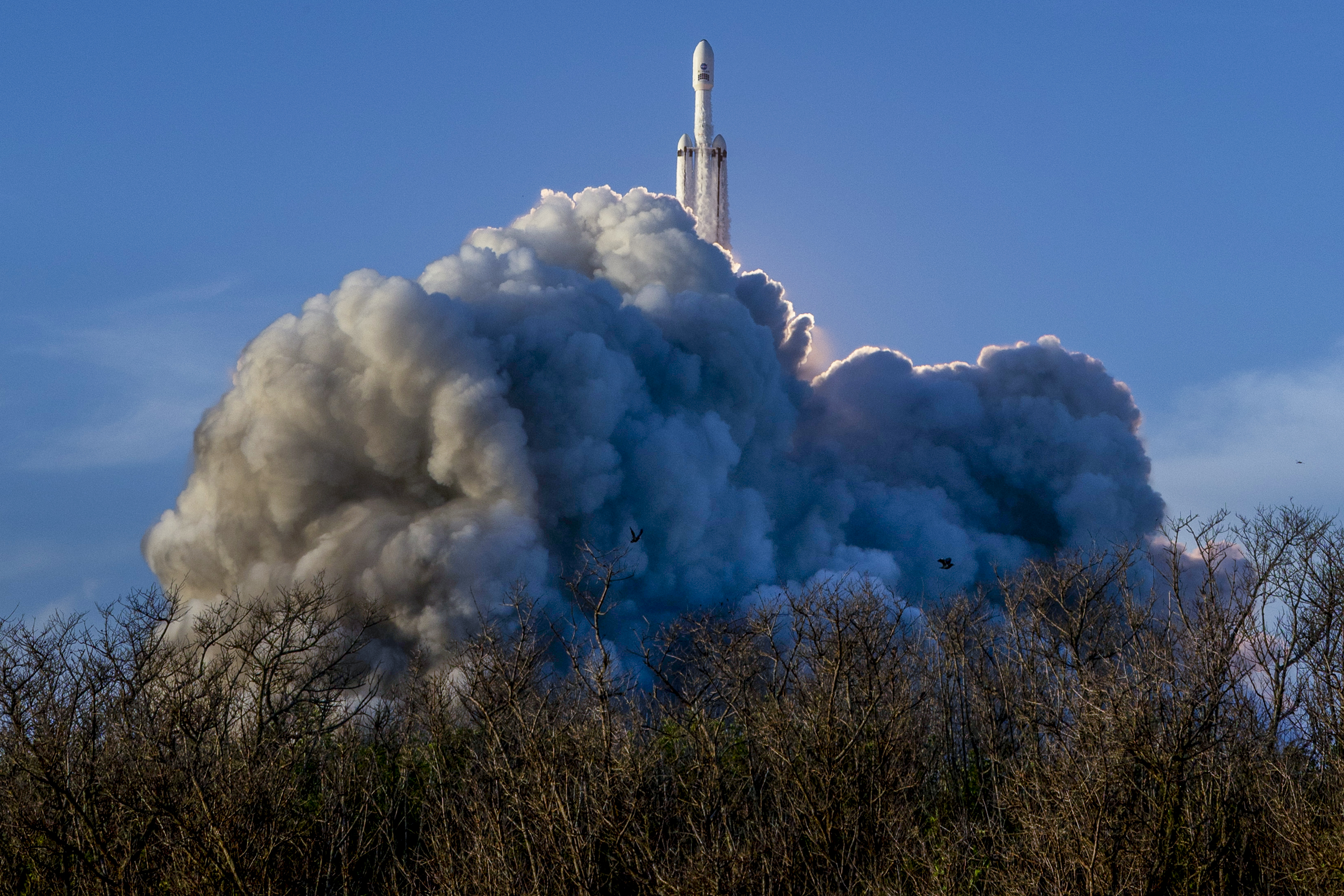 A SpaceX Falcon Heavy rocket launches with NASA’S Nancy Grace Roman Space Telescope onboard from Launch Complex 39A, Sunday, Aug. 30, 2026, at NASA’s Kennedy Space Center in Florida. Roman will investigate dark energy and dark matter, conduct a statistical census of planetary systems, and enable a broad range of additional astrophysics research. Launch occurred at 7:26 a.m. EDT. Photo Credit (NASA/Joel Kowsky)