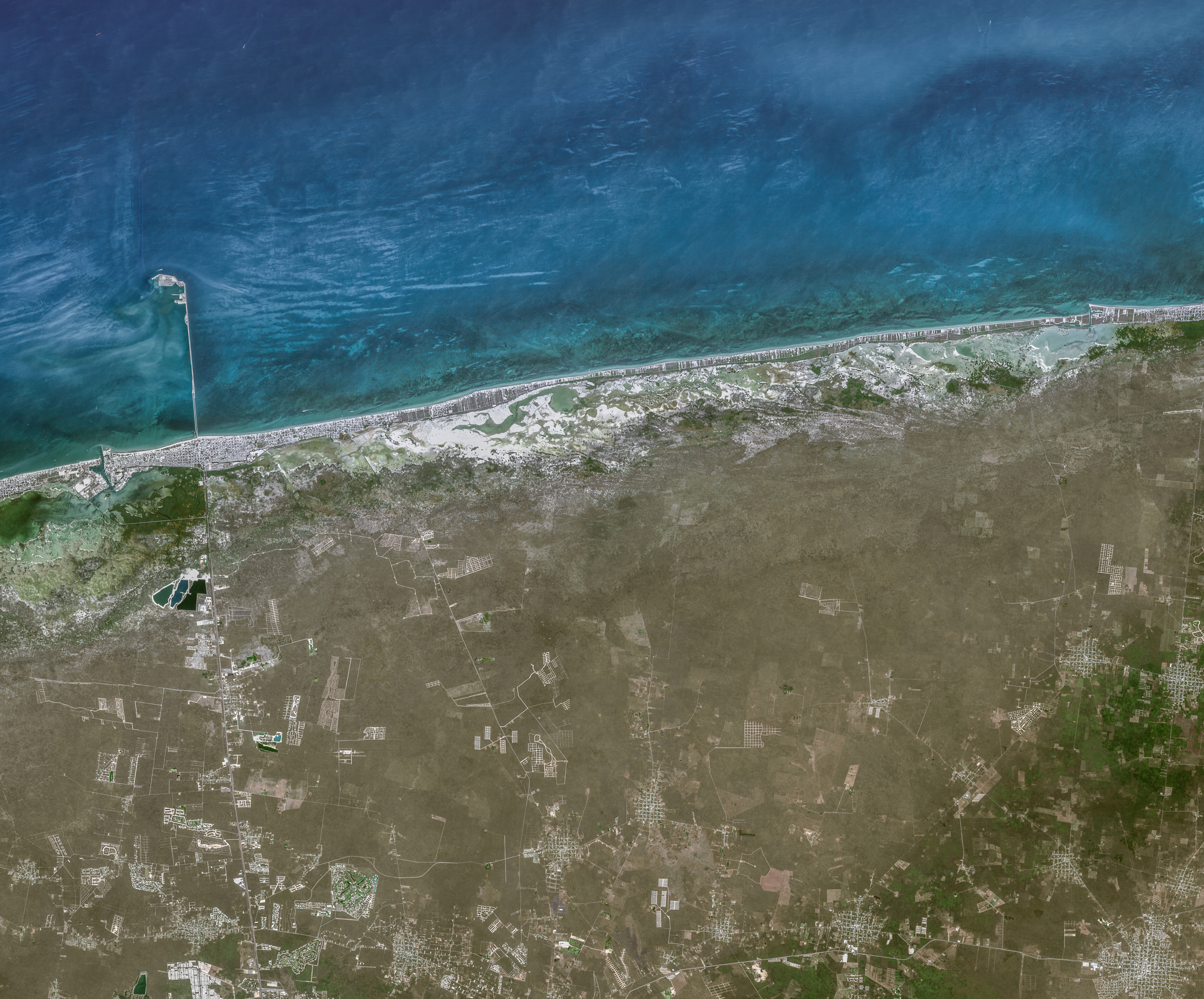 YUCATAN PENINSULA, MEXICO -- APRIL 13, 2025: 01 -- Sentinal-2 satellite imagery shows a closer section of the northern Yucatan Peninsula coastline and adjacent Gulf of Mexico waters over the Chicxulub impact crater region near Chicxulub. The image documents the coastal land-water boundary and shallow marine zone associated with the buried crater structure. Please use: Satellite image (c) 2026 Vantor..  (Photo enhanced and published by maps4media via Getty Images)