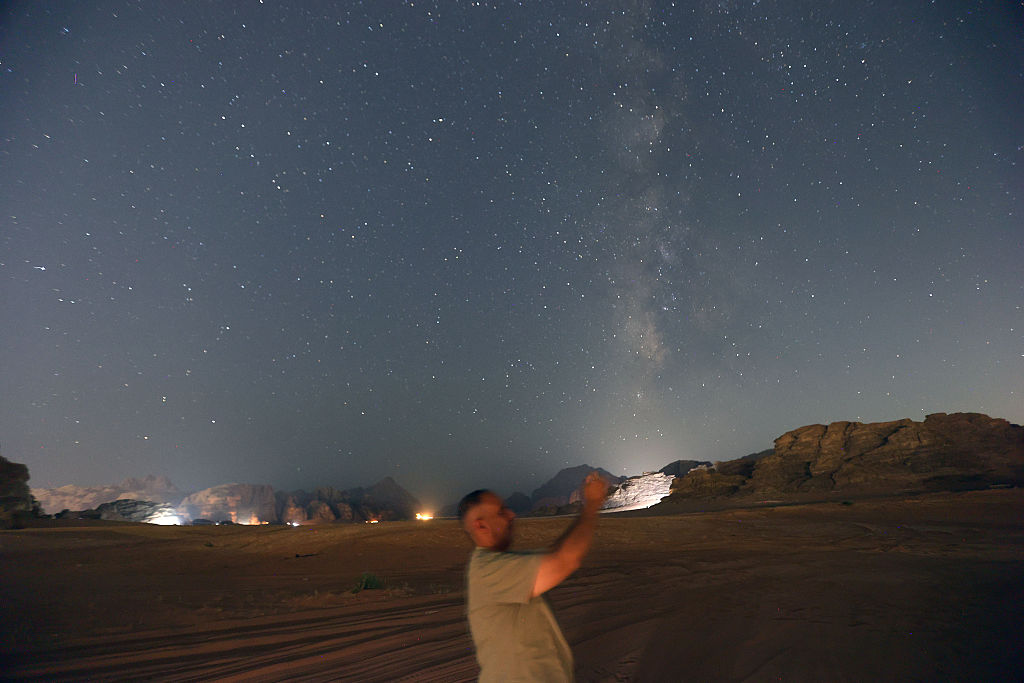 Stars appear in the sky over the desert during the peak of the Perseid meteor shower on August 12, 2026 in Wadi Rum, Jordan. (Image Source: Getty/Salah Malkawi)