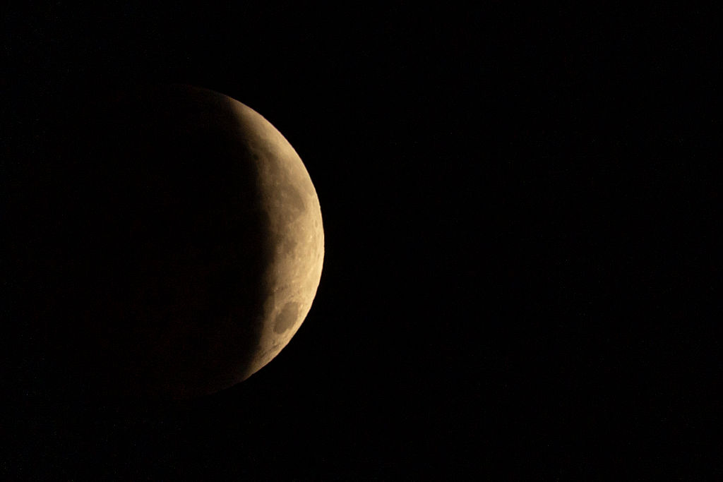 A partial lunar eclipse is seen across Pegwell Bay on August 28, 2026 in Ramsgate, England. The event saw the Moon obscured by Earth’s shadow, with around 93% of its visible diameter covered at the eclipse’s peak. (Photo by Brook Mitchell/Getty Images)