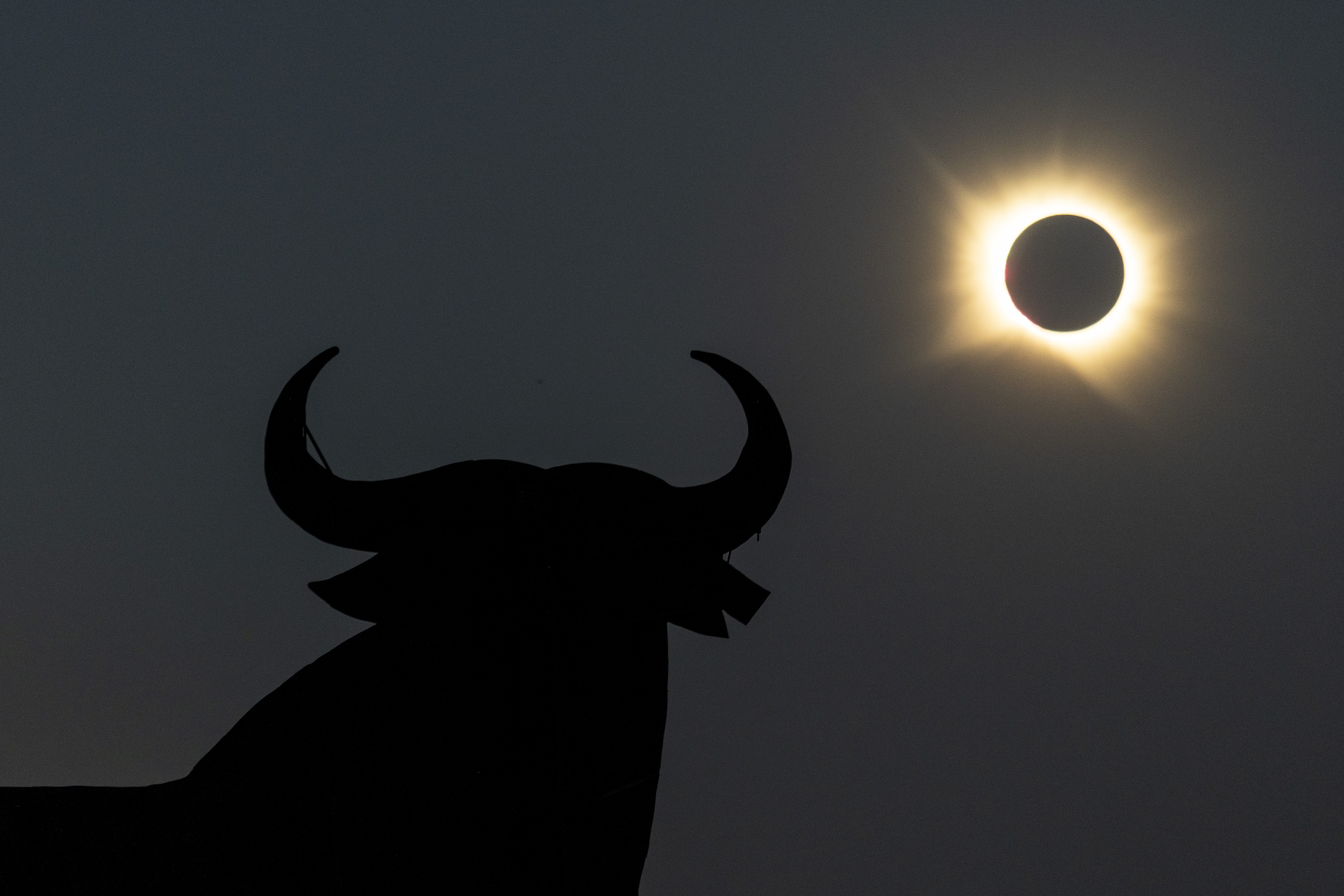 GUADALAJARA, SPAIN - AUGUST 12: A view of the sun behind El Toro Osborne 'The Osborne Bull' during the total solar eclipse on August 12, 2026 in Guadalajara, Spain. It was the first time a total solar eclipse, when the sun is blocked by the moon's orbit, could be viewed from Spain since 1905. (Photo by Pablo Blazquez Dominguez/Getty Images)