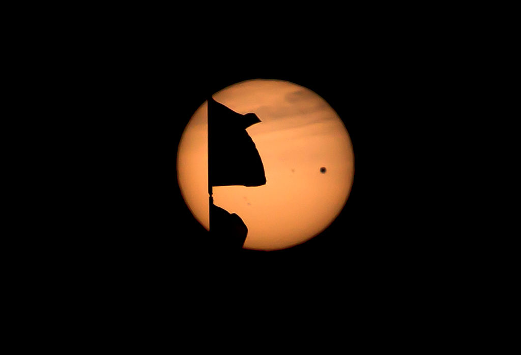 The transit of Venus over the skies of Santa Monica beach. The little black dot in the upper right hand of the sun is the planet Venus beginning it's transit across the sun. (Photo by Ted Soqui/Corbis via Getty Images)